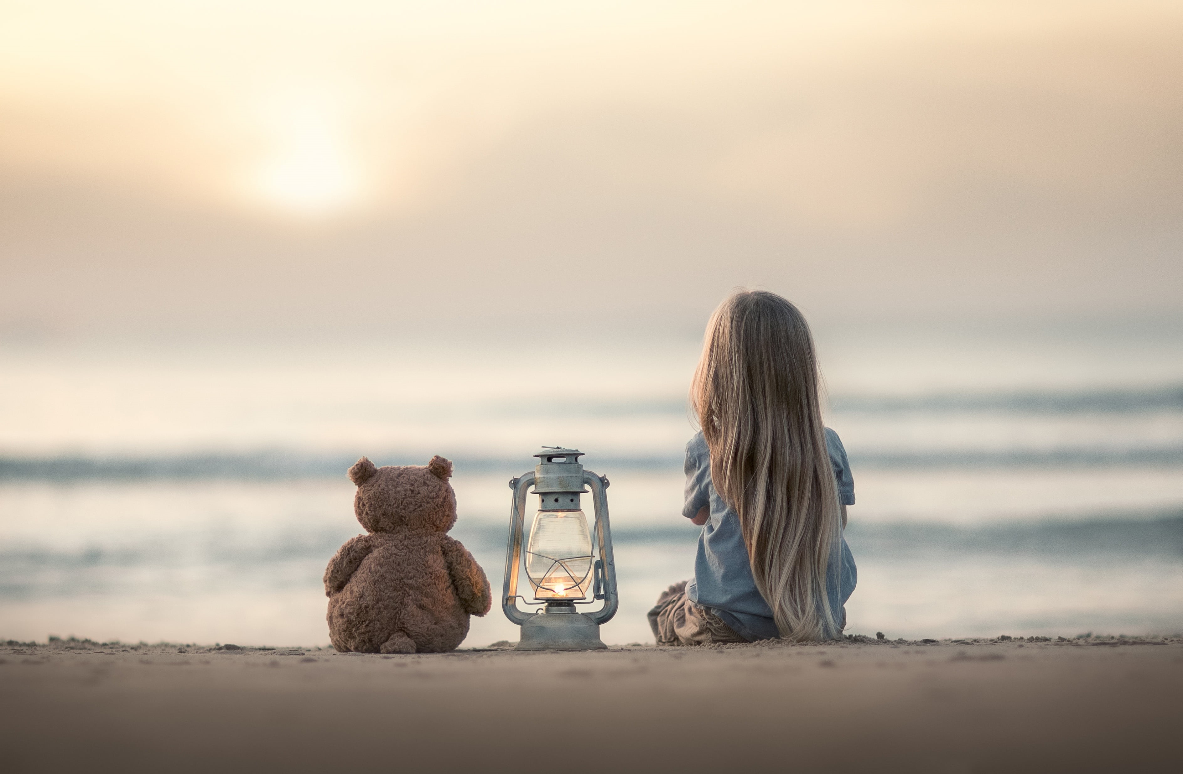 Teddy bear, sand, sea, beauty in nature, beach, sunset, toy, 2K, one person, mood, leisure activity, nature, sky, scenics - nature, tranquility, sitting, HD Wallpaper