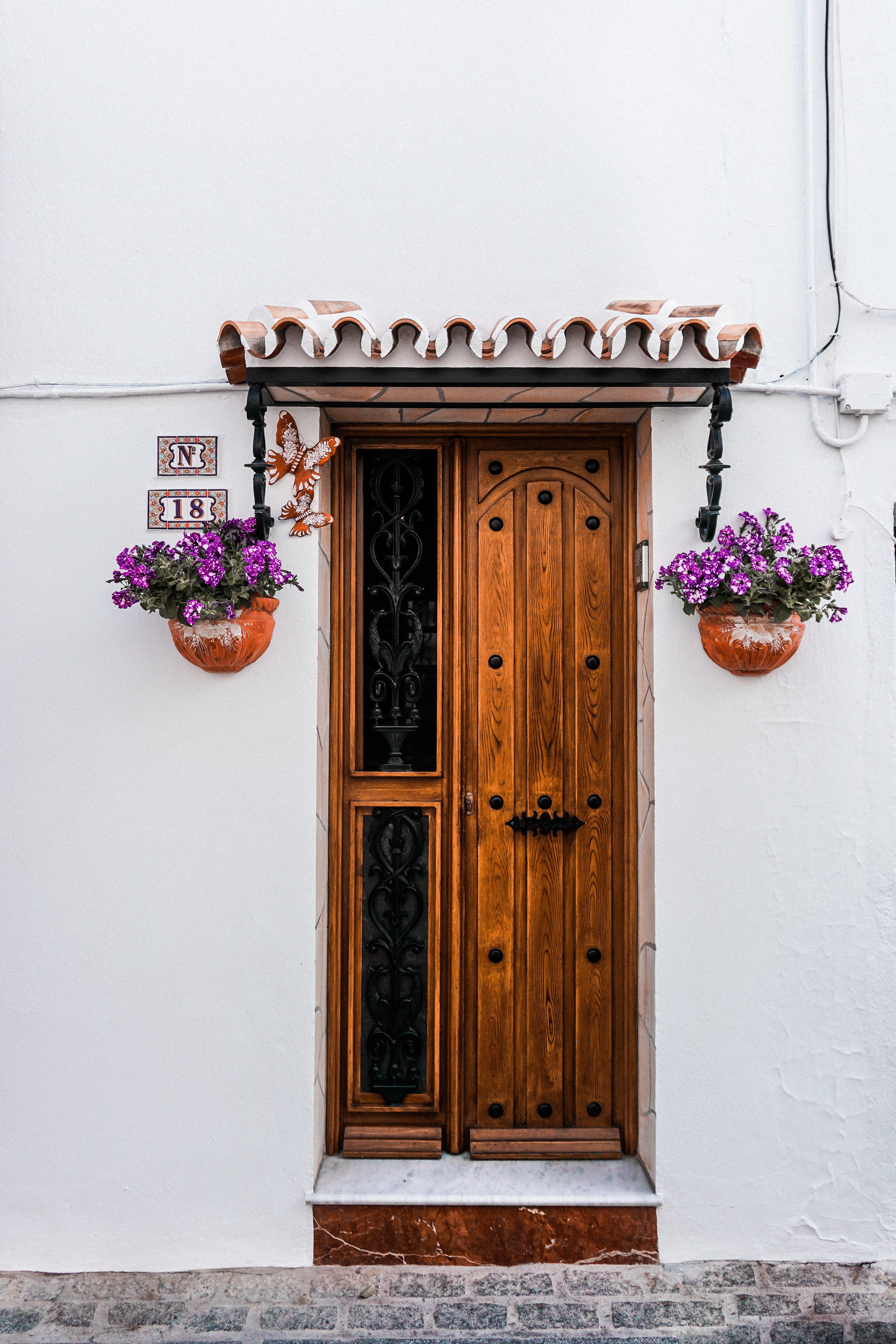two, purple, nature, closed, exterior, front, ornate, plant, door, flowers, day, architecture, security, daytime, house, wooden, doorway, cobblestones, Phone HD Wallpaper
