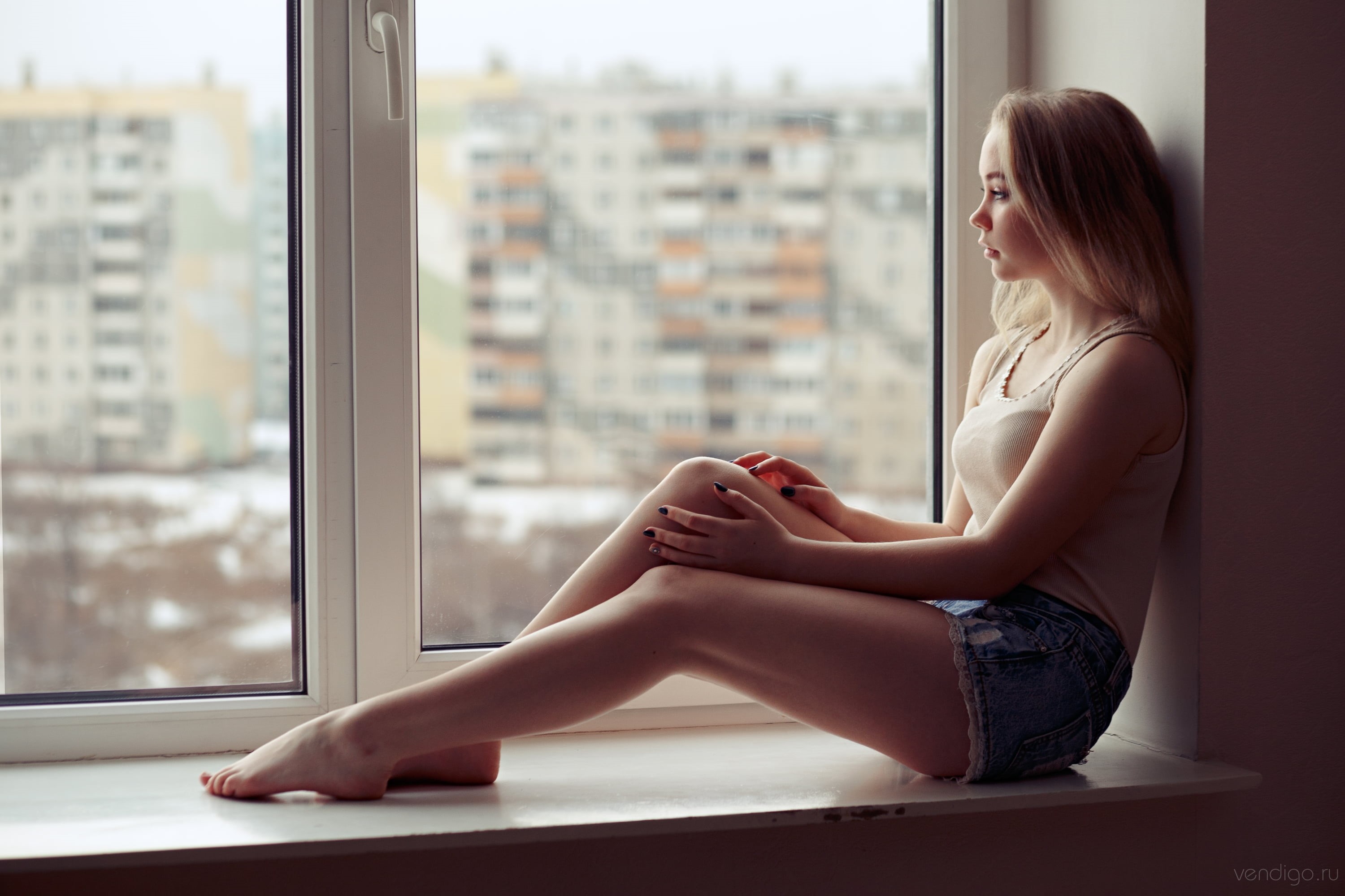 tiptoe, women, window, barefoot, jean shorts, model, black nails, profile, tank top, indoors, looking out window, 2K, Evgeniy Bulatov, depth of field, HD Wallpaper