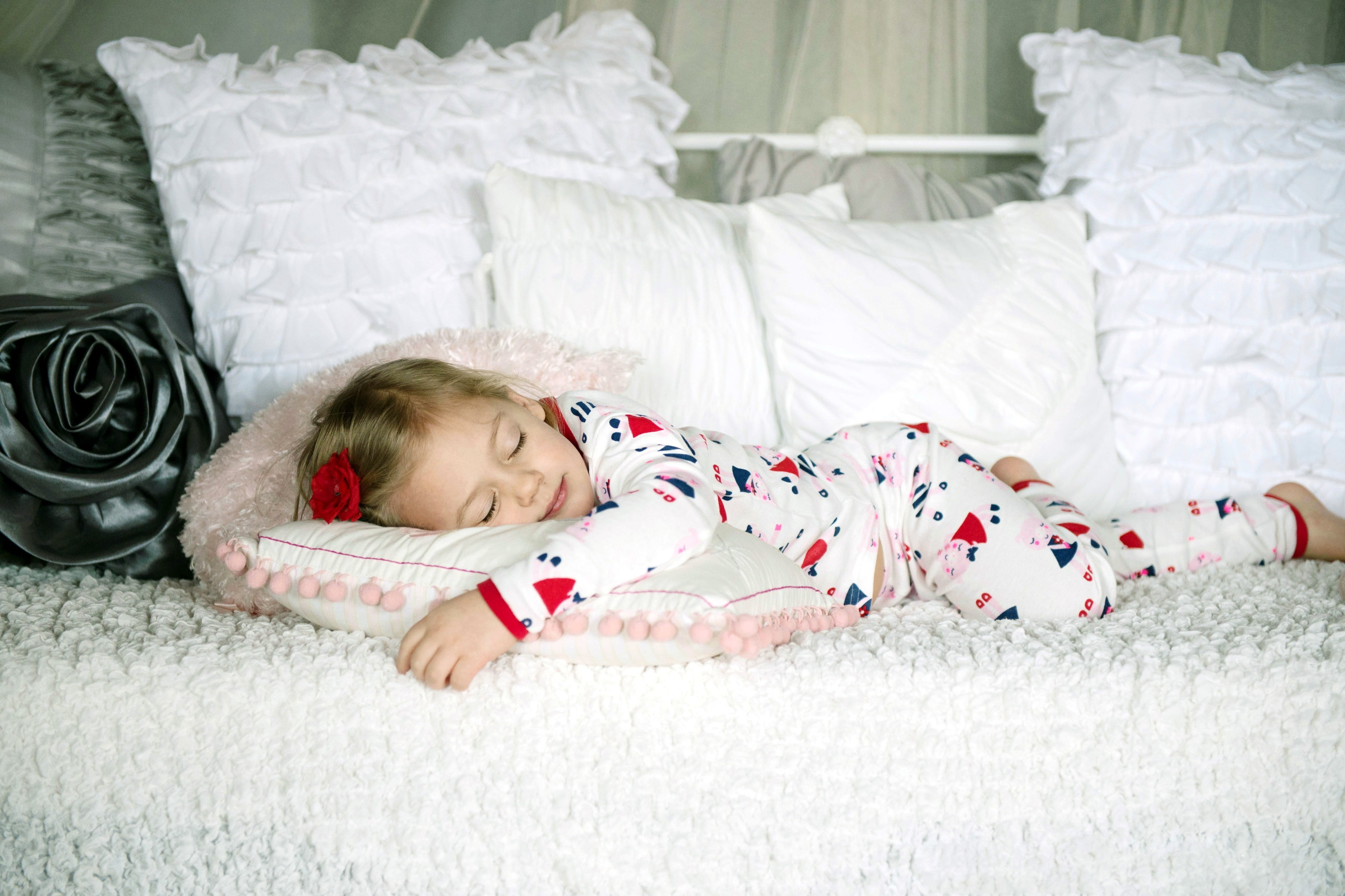  full screen, white, background, sleeping, one person, pillow, red, HD, widescreen, footie, lying down, girl, child, full length, indoors, HD Wallpaper