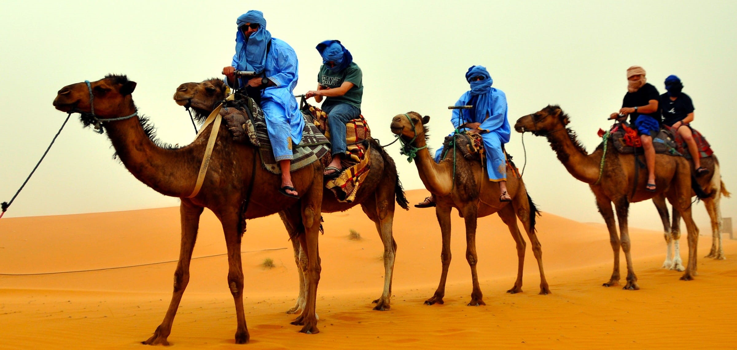 pets, livestock, africa, herbivorous, vertebrate, camel, dromedary, riding, domestic, animal themes, mammal, sand dune, people, sky, men, working animal, HD Wallpaper