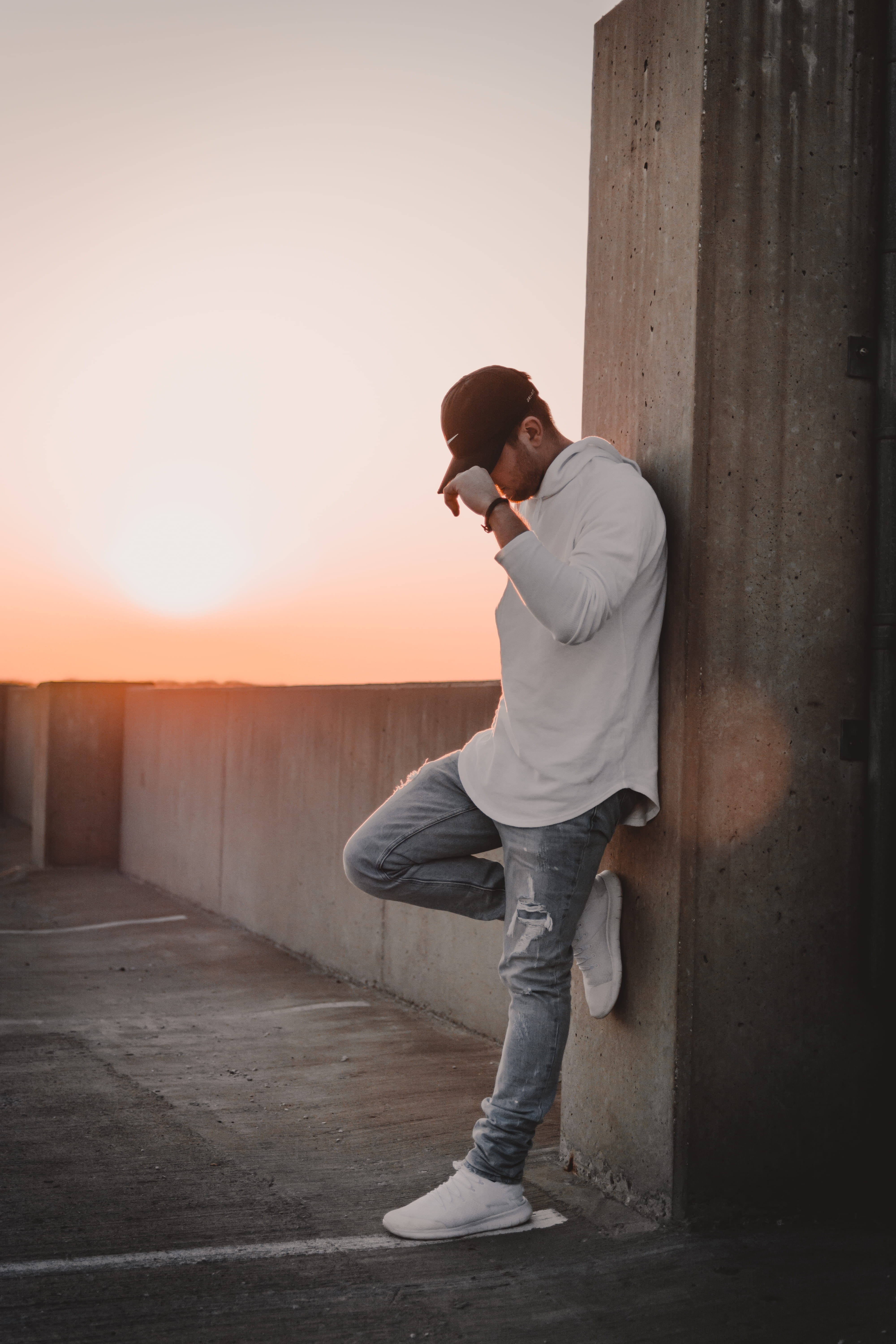 looking, side view, wall, real people, teenager, dusk, standing, sunset, pillar, lifestyles, casual clothing, architecture, young men, 5K, hoodie, nature, Phone HD Wallpaper