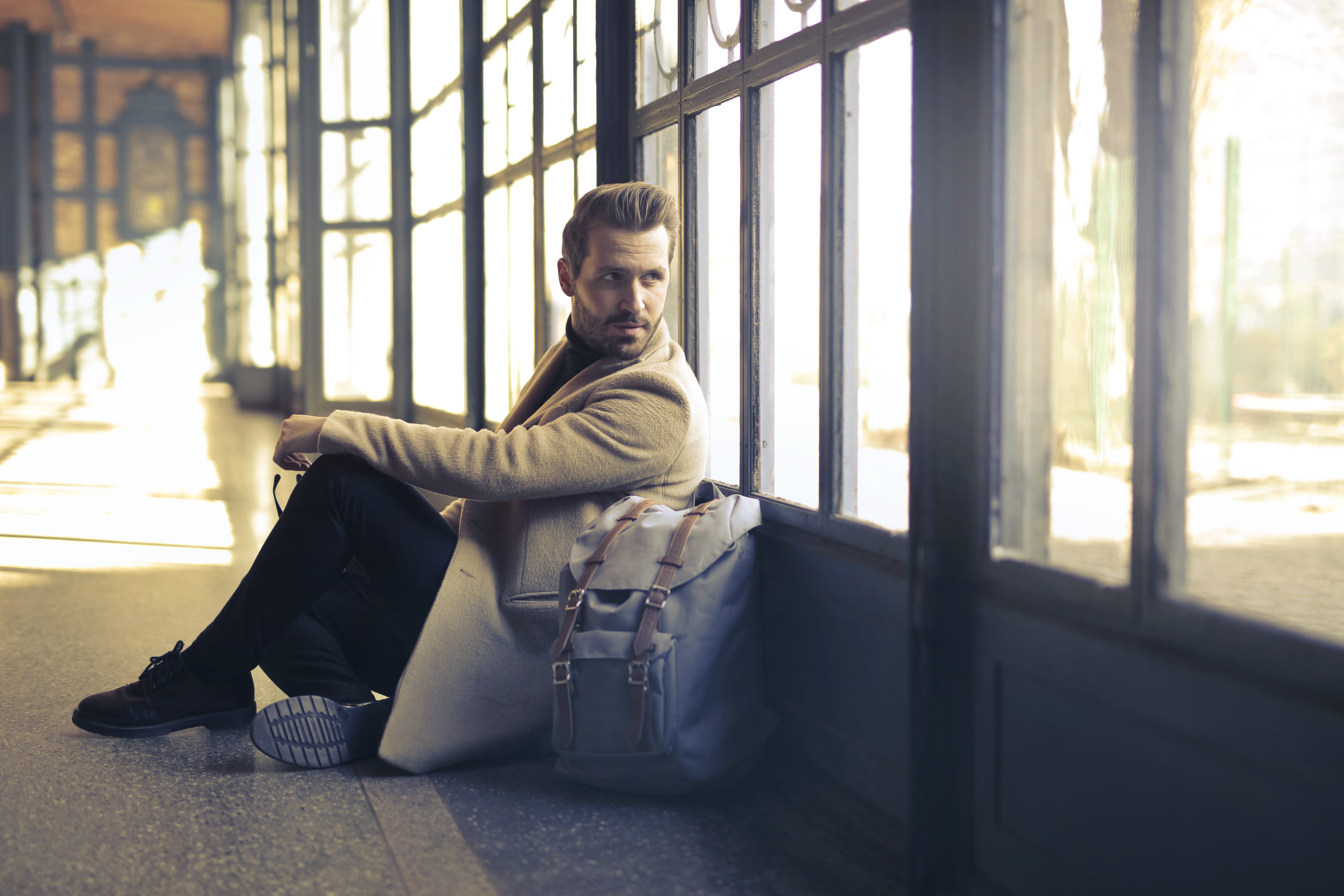 men, facial hair, coat, fashion, white, 5K, backpack, casual clothing, near, brown, glass, lifestyles, windows, wearing, full length, person, man, handsome, HD Wallpaper
