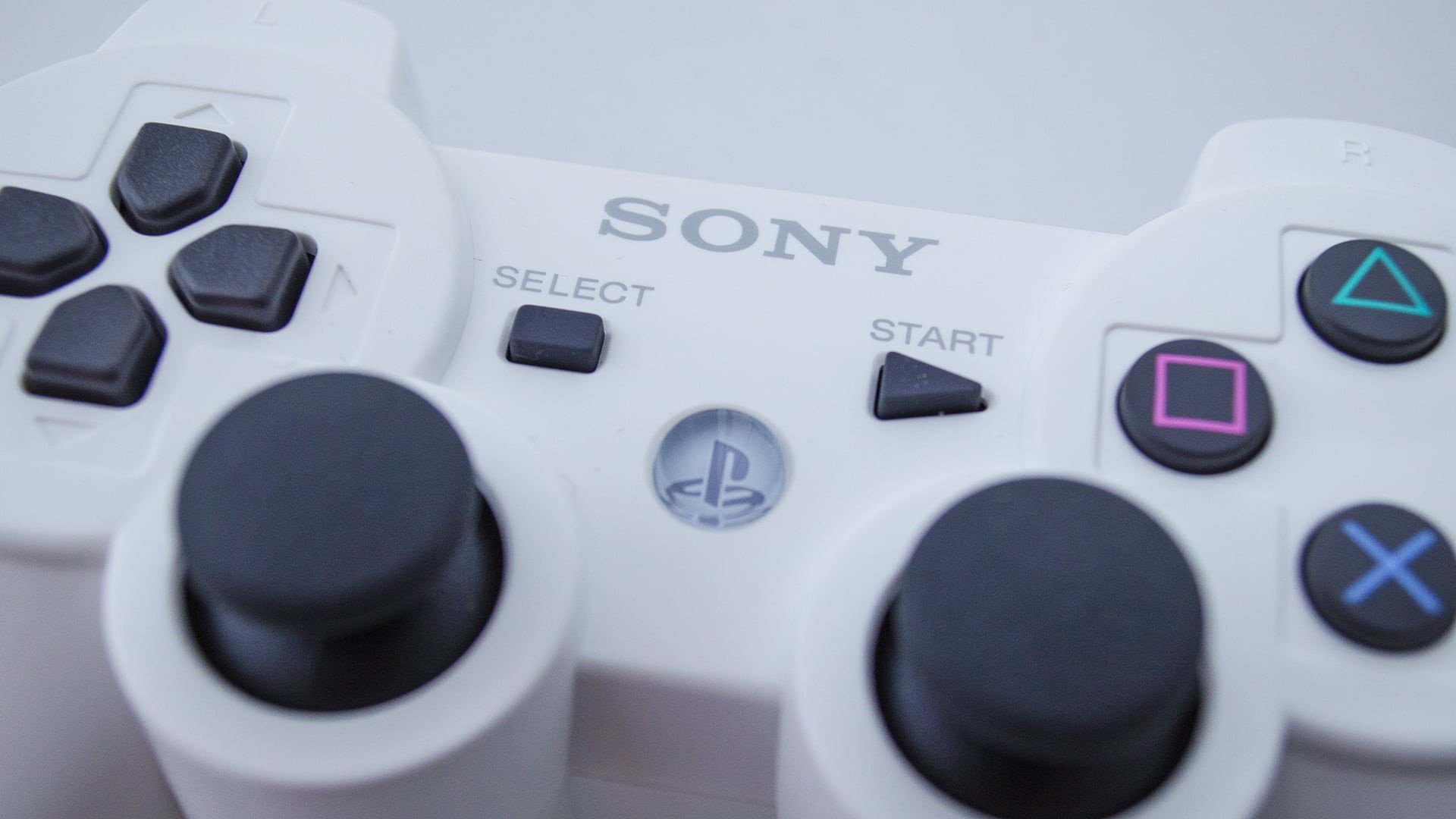 focus on foreground, close-up, Sony, control panel, white color, circle, indoors, no people, equipment, music, number, machinery, controllers, text, PlayStation, HD Wallpaper