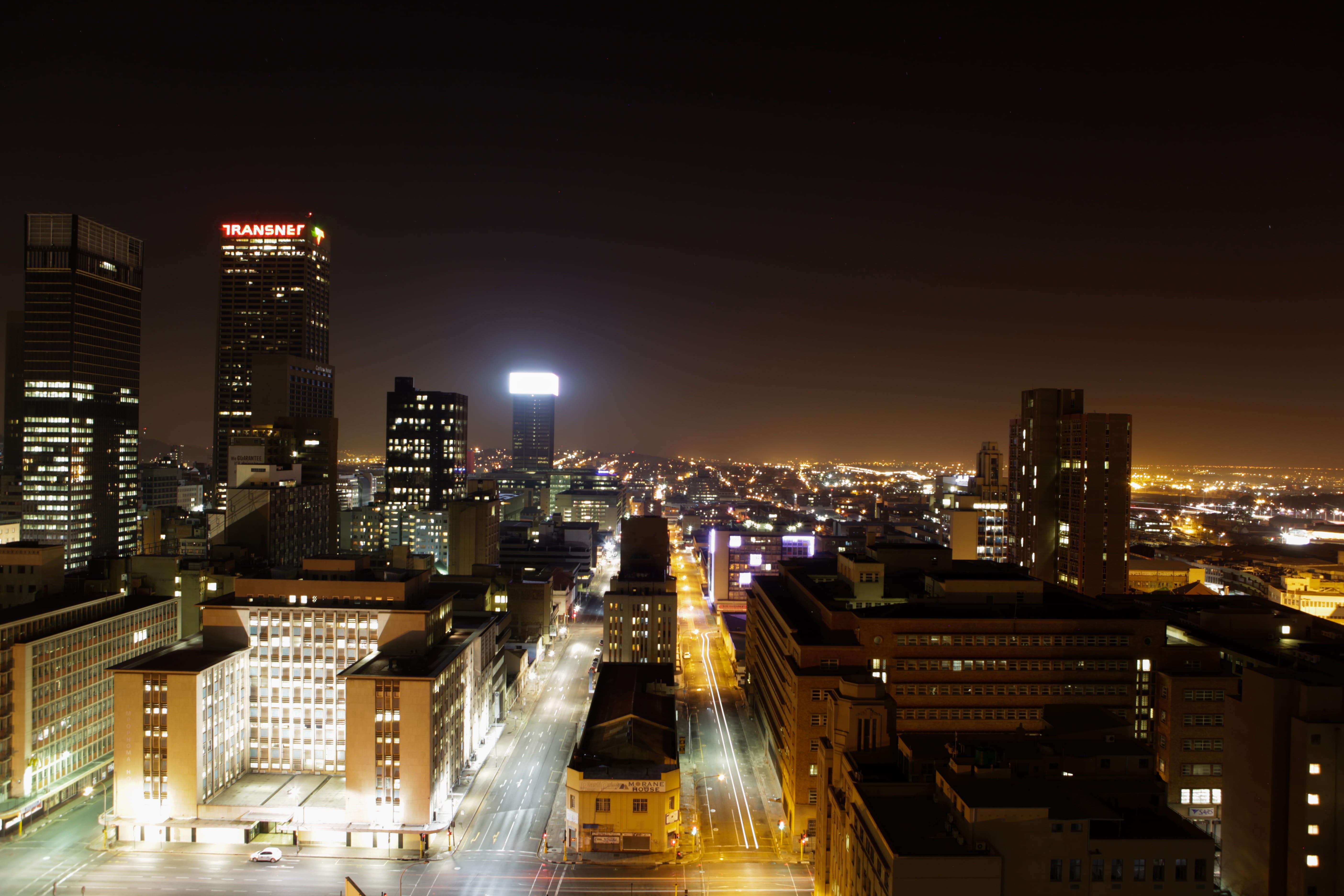financial district, night, street, lit, transportation, building exterior, 5K, cityscape, sky, architecture, busy, skyscraper, city life, office building exterior, HD Wallpaper