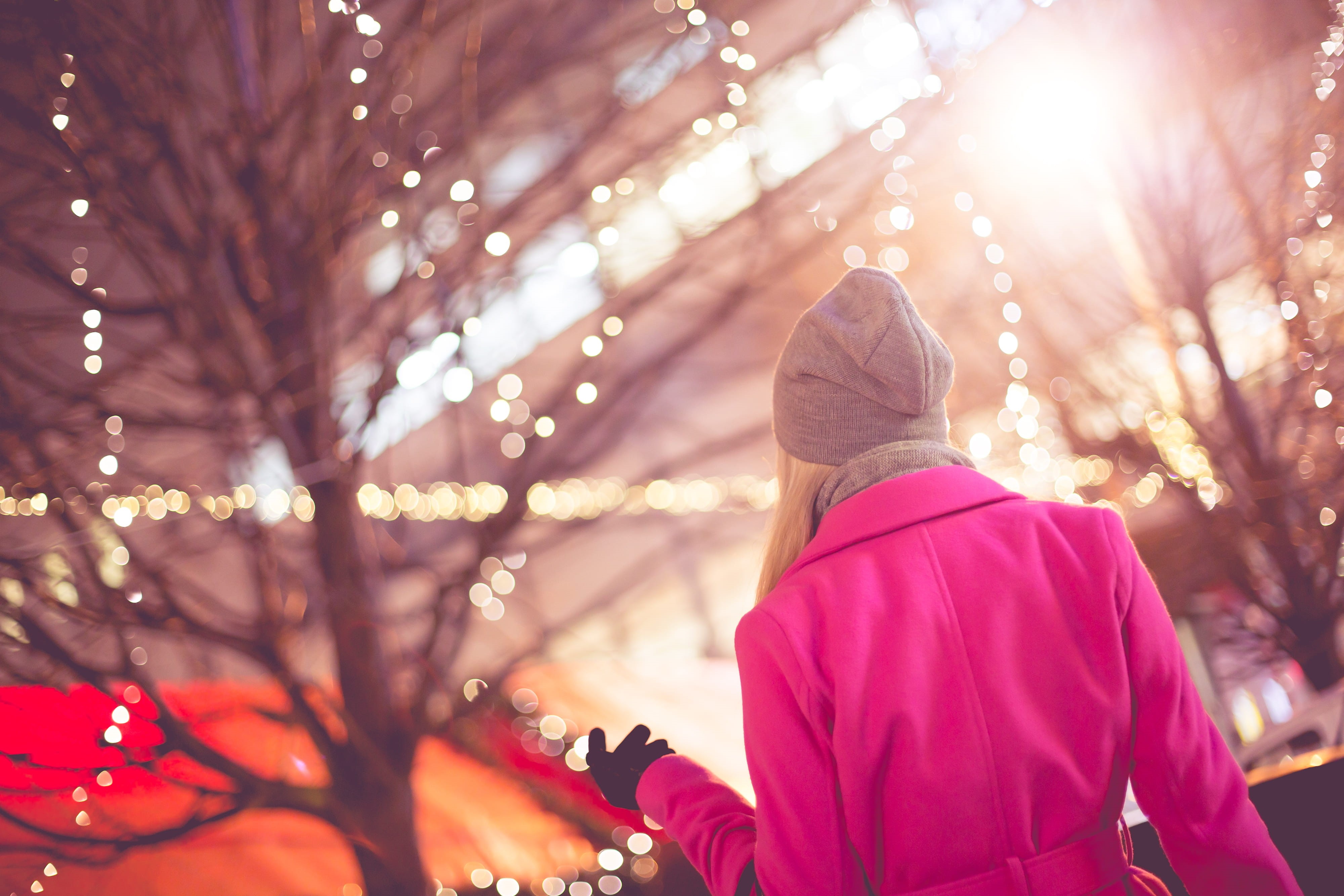 coat, warm Clothing, outdoors, celebration, lens flare, fashion, women, holiday, caucasian Ethnicity, focus on foreground, tree, plant, christmas lights, HD Wallpaper