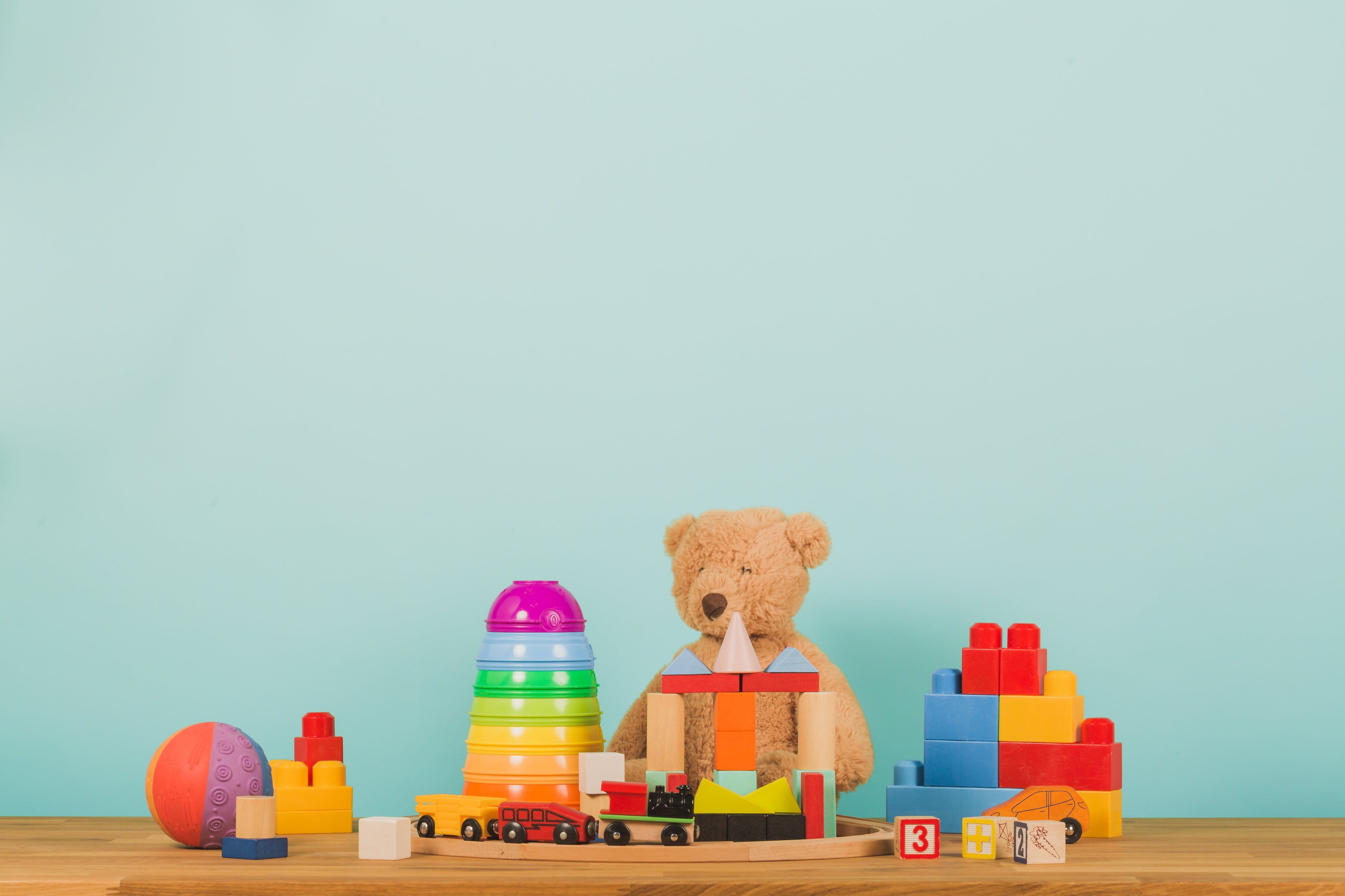 table, food, toy block, 4K, Toys, candle, group of objects, no people, blue, multi colored, studio shot, still life, kids, sitting, blue background, copy space, HD Wallpaper