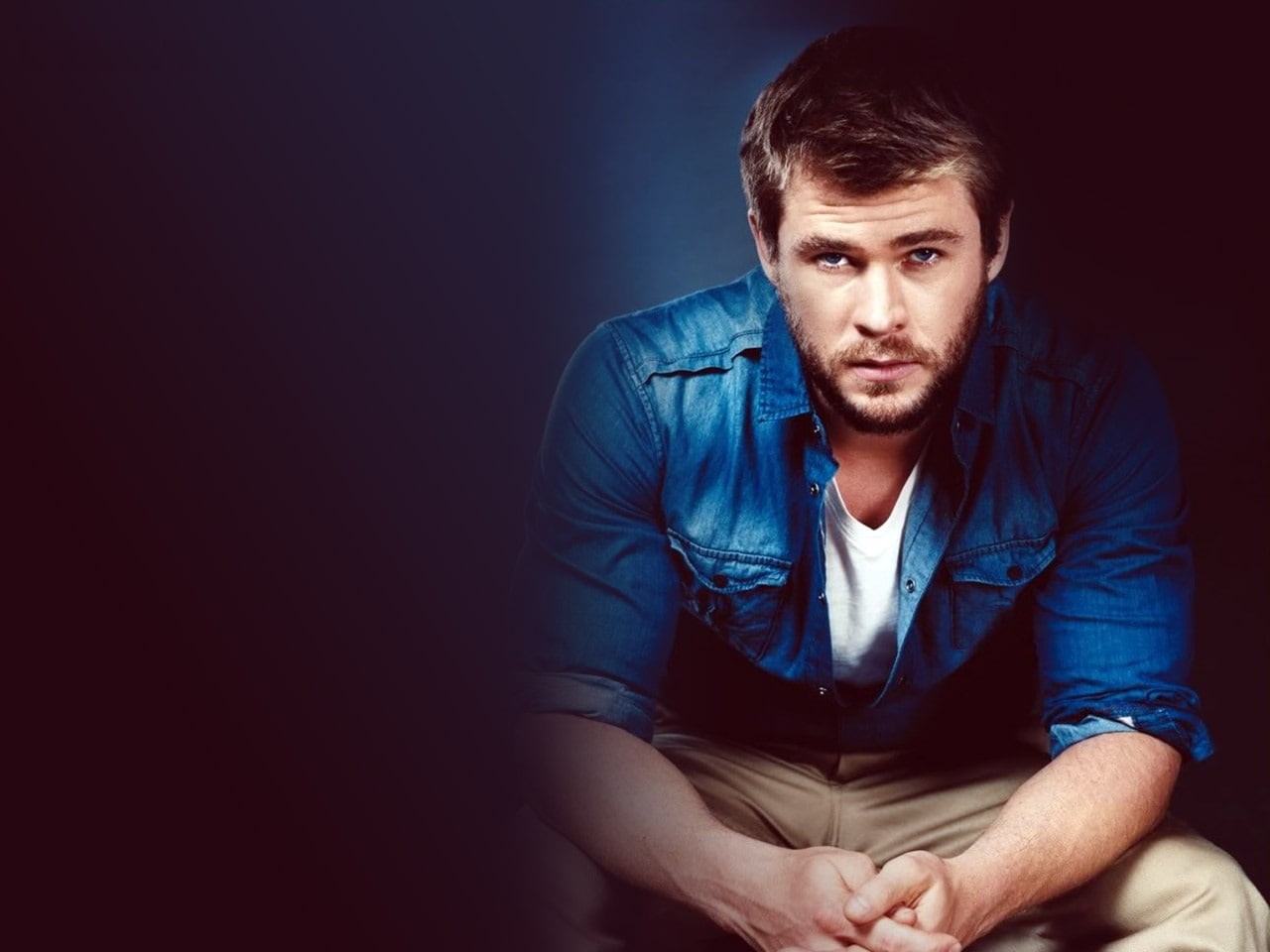 720P, hemsworth, copy space, casual clothing, chris, males, hollywood, young adult, blue, indoors, dark, looking, sitting, american, looking at camera, HD Wallpaper