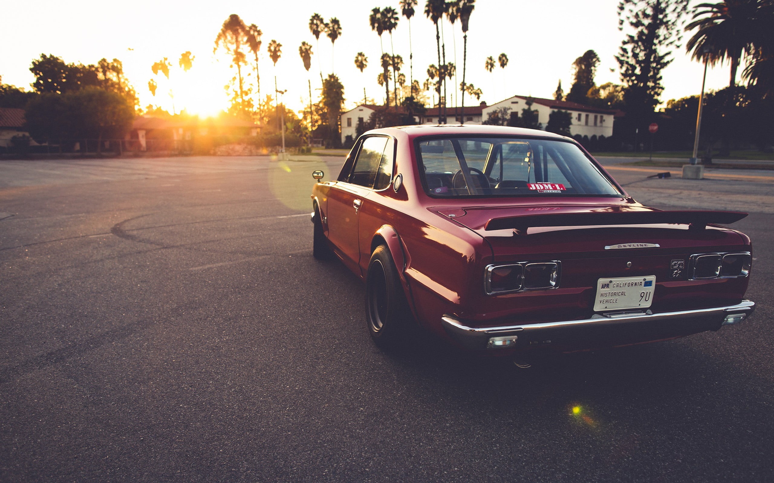 red, outdoors, mode of transportation, sunset, Nissan GTR, vehicle, 2K, sunlight, travel, plant, sky, road, no people, nature, transportation, retro styled, HD Wallpaper