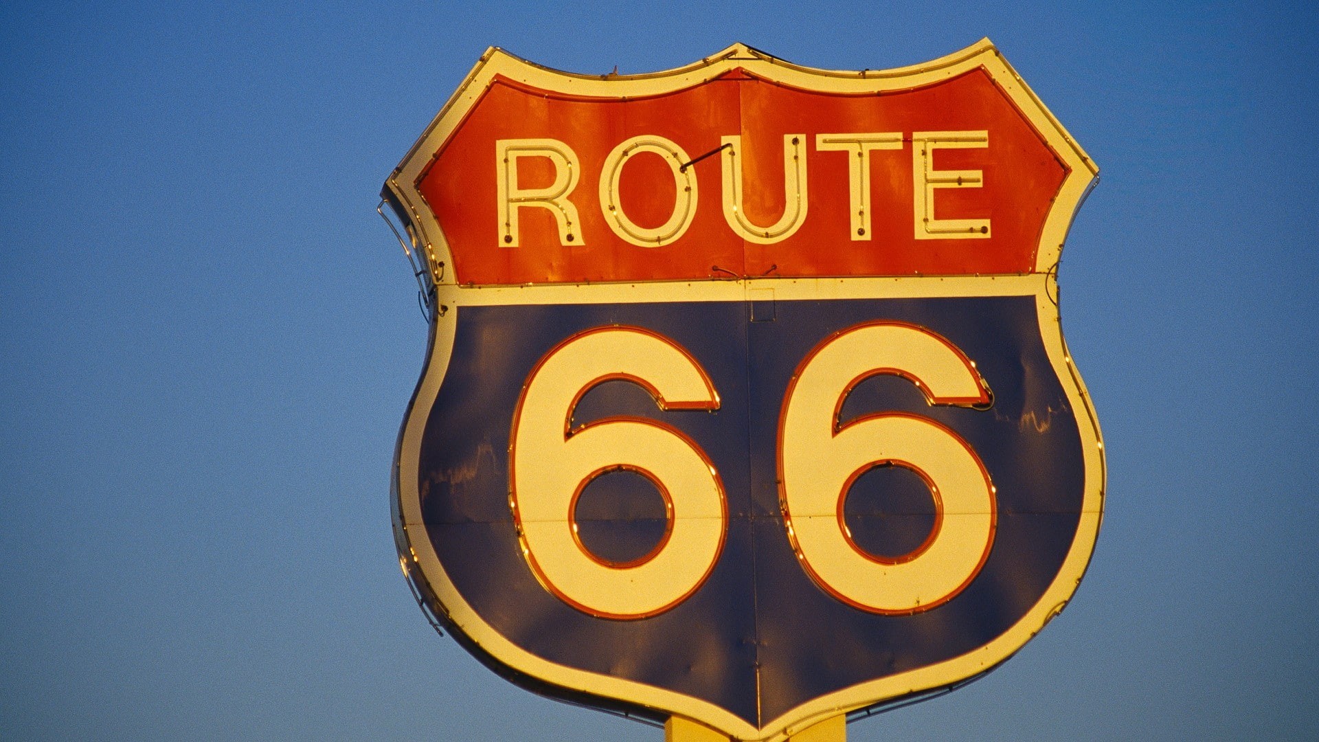 illuminated, low angle view, Route 66, architecture, road, yellow, city, sky, blue background, neon, blue, road sign, text, day, western script, numbers, HD Wallpaper