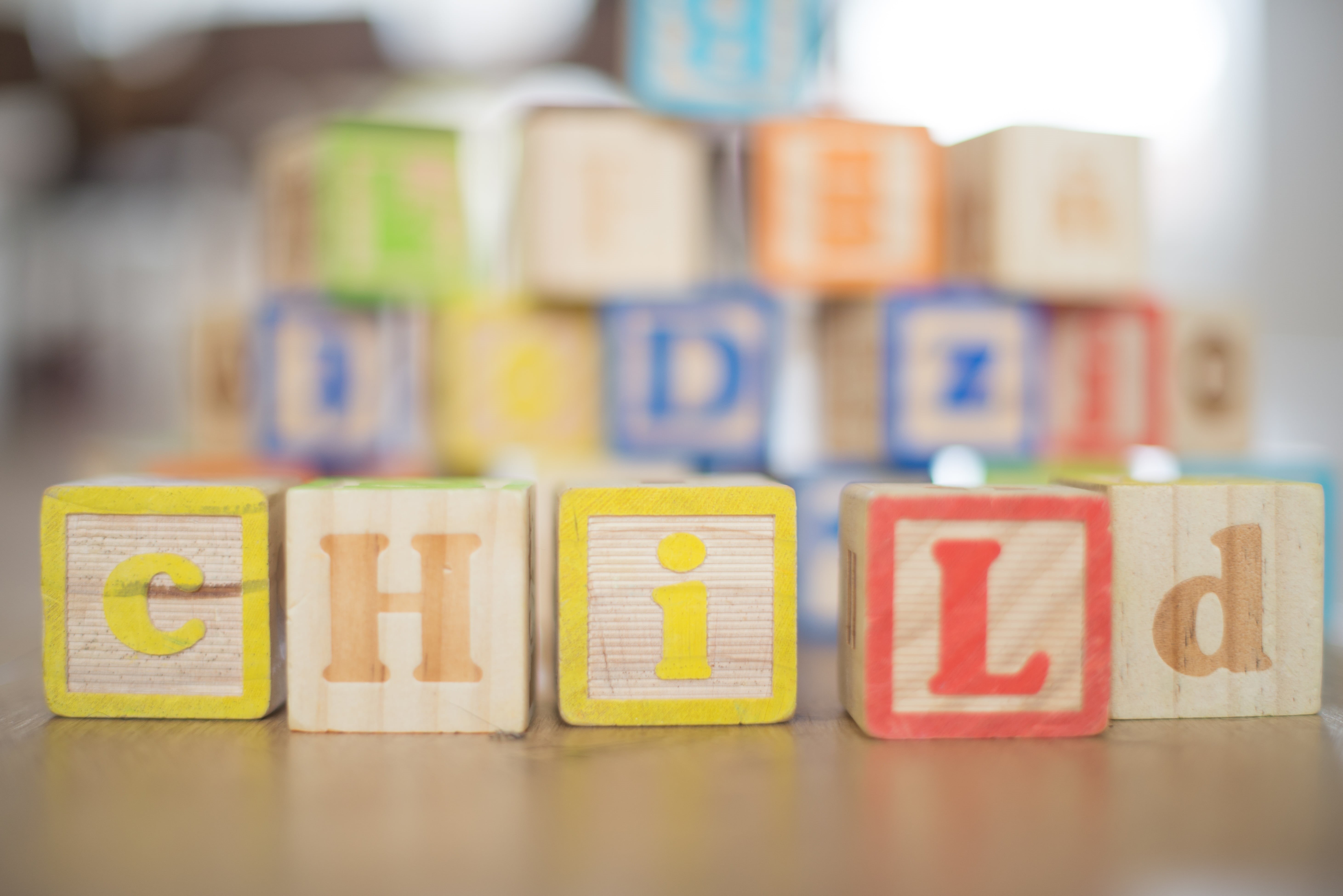 focus on foreground, toddler, playing, toy, education, kindergarten, classroom, joy, wood - material, letter, multi colored, number, toy block, blocks, HD Wallpaper