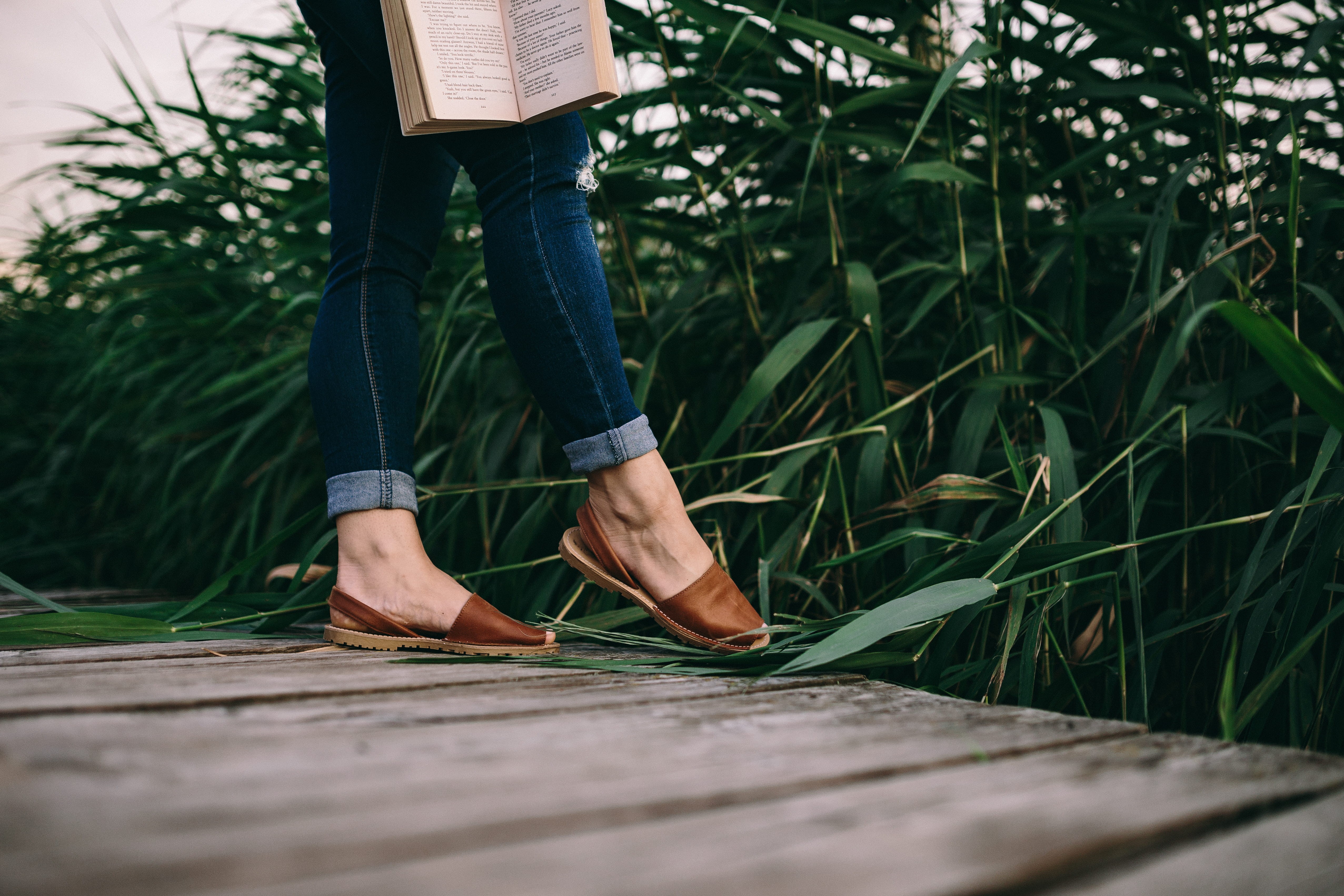 one Person, jeans, outdoors, woman with book, human limb, casual clothing, resting, man with book, 4K, time, day, leisure activity, green color, footpath, HD Wallpaper