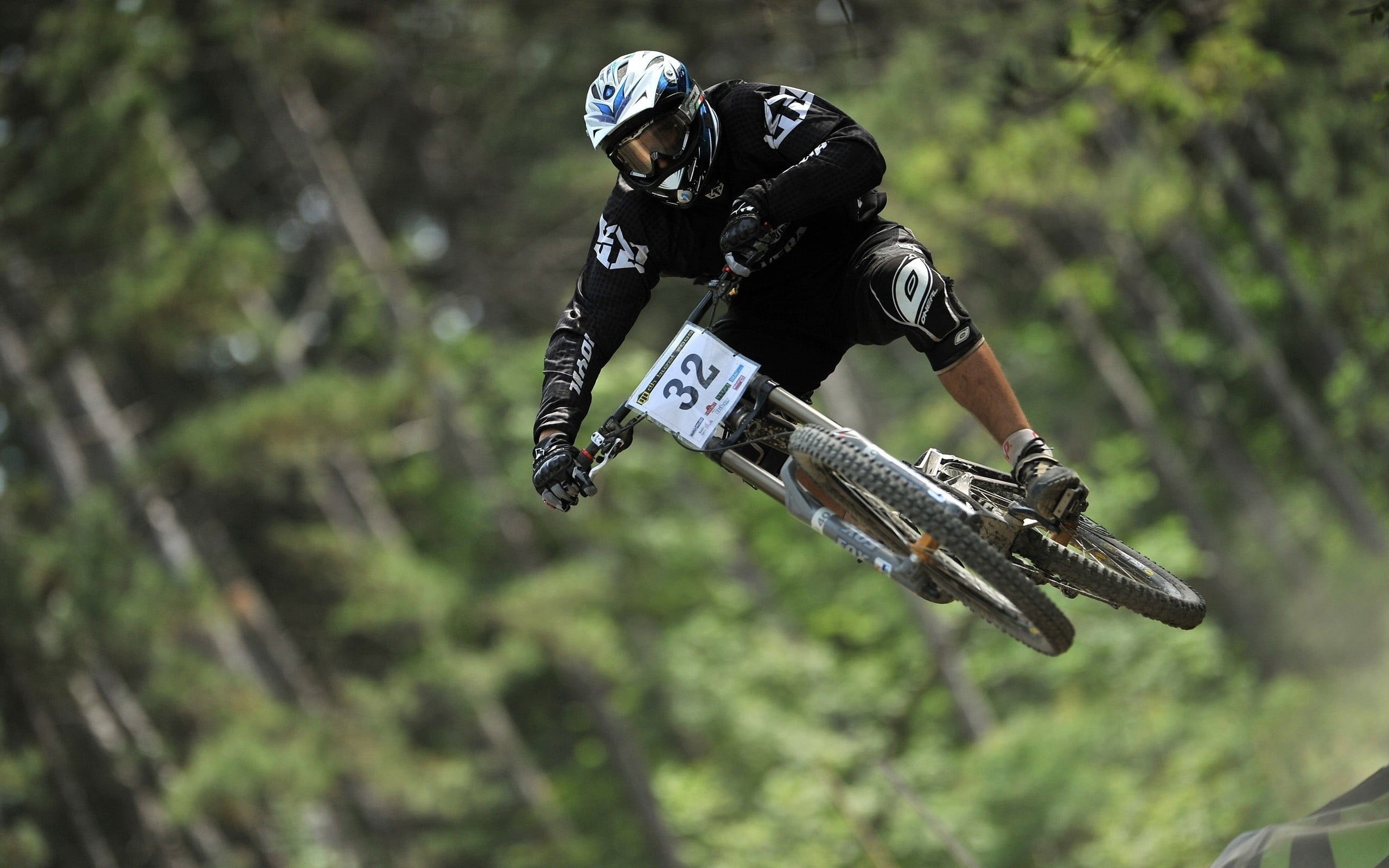 white, soaring, tree, motion, helmet, mountain, pants, focus on foreground, wearing, day, full length, long, 2K, leisure activity, jumping, face, racer, HD Wallpaper