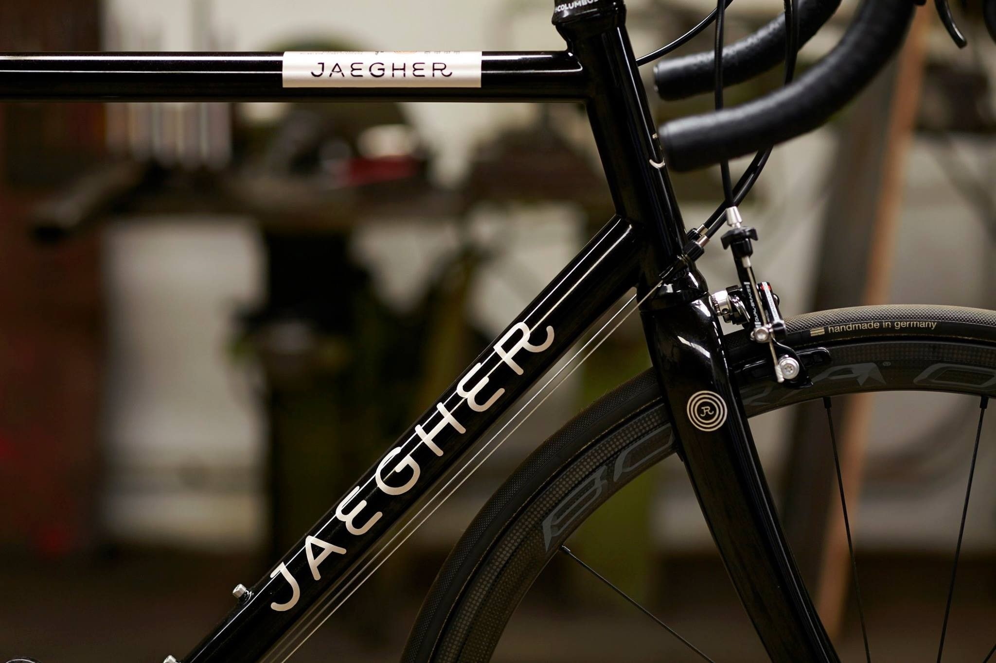 close-up, bicycle, cycling, tire, wheel, outdoors, wheels, stationary, handlebar, selective focus, spoke, metal, 1080P, sign, western script, focus on foreground, HD Wallpaper