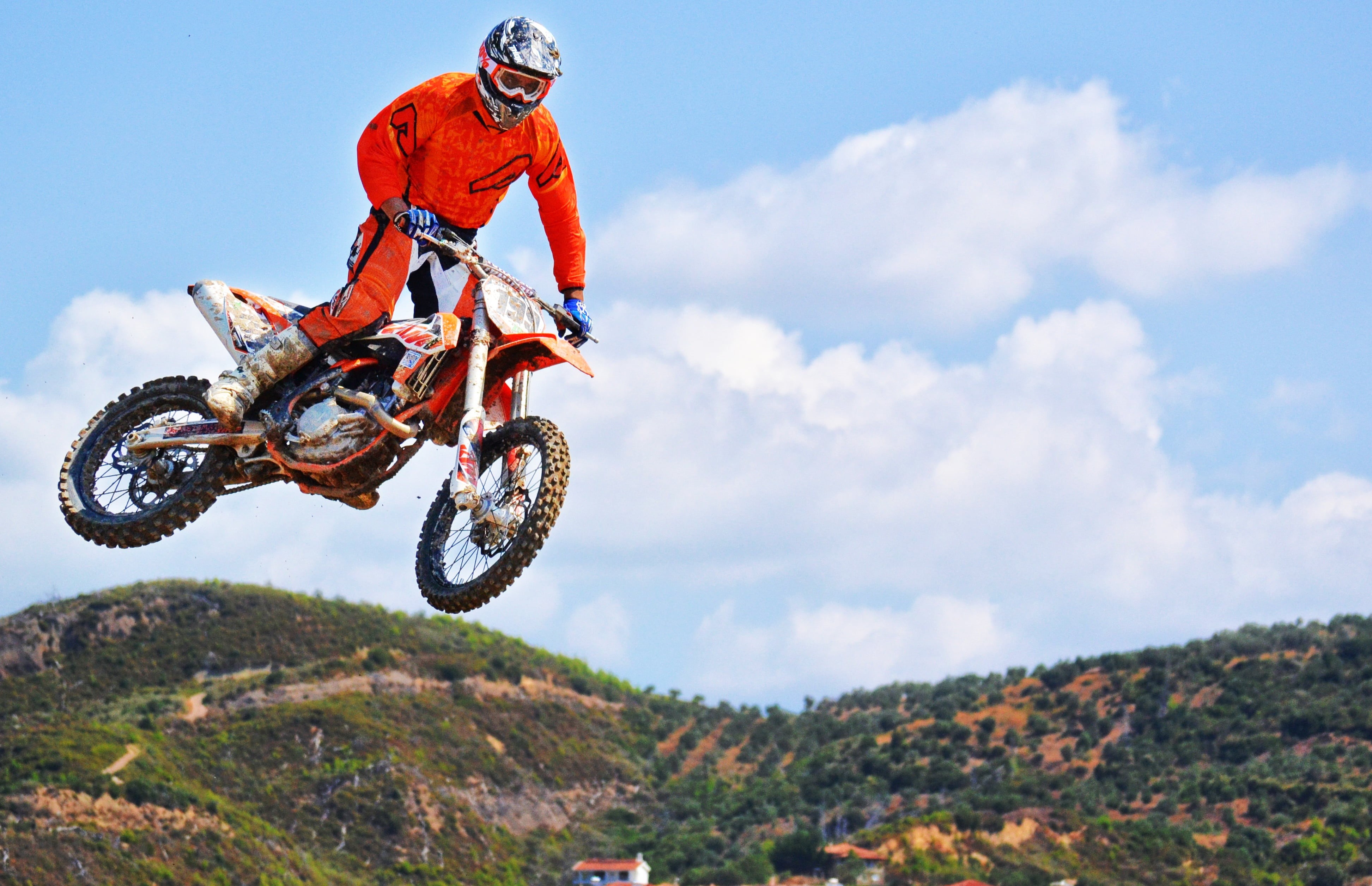 day, jump, uniform, driver, one person, suit, boots, riding, mid-air, sports Race, motorbike, motor, race, racing, man, headwear, helmet, skill, crash helmet, HD Wallpaper