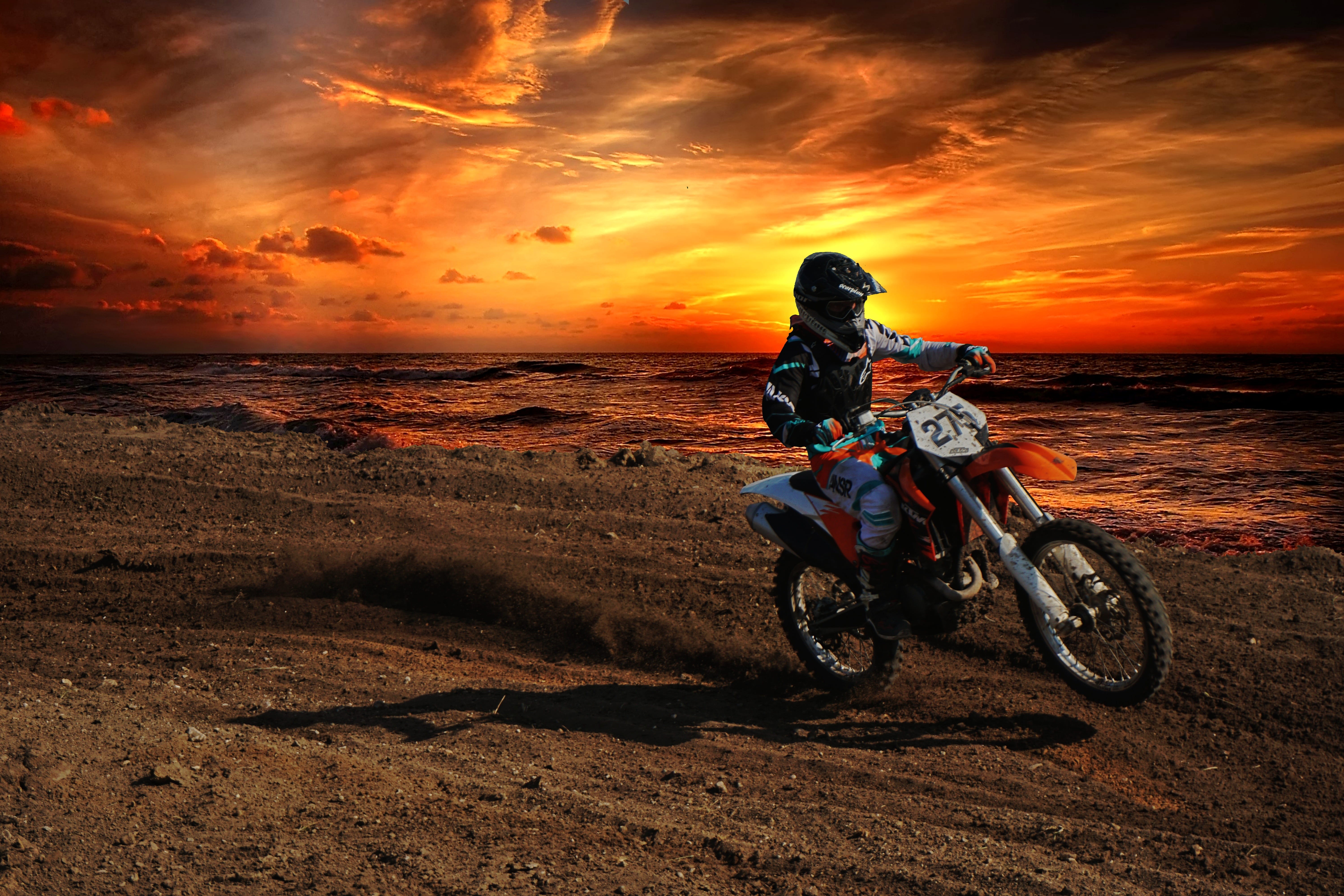 belize, sky, dirt bike, crash helmet, orange color, sea, bike, ocean, helmet, ktm, mode of transportation, spanish lookout, sunset, full length, riding, HD Wallpaper