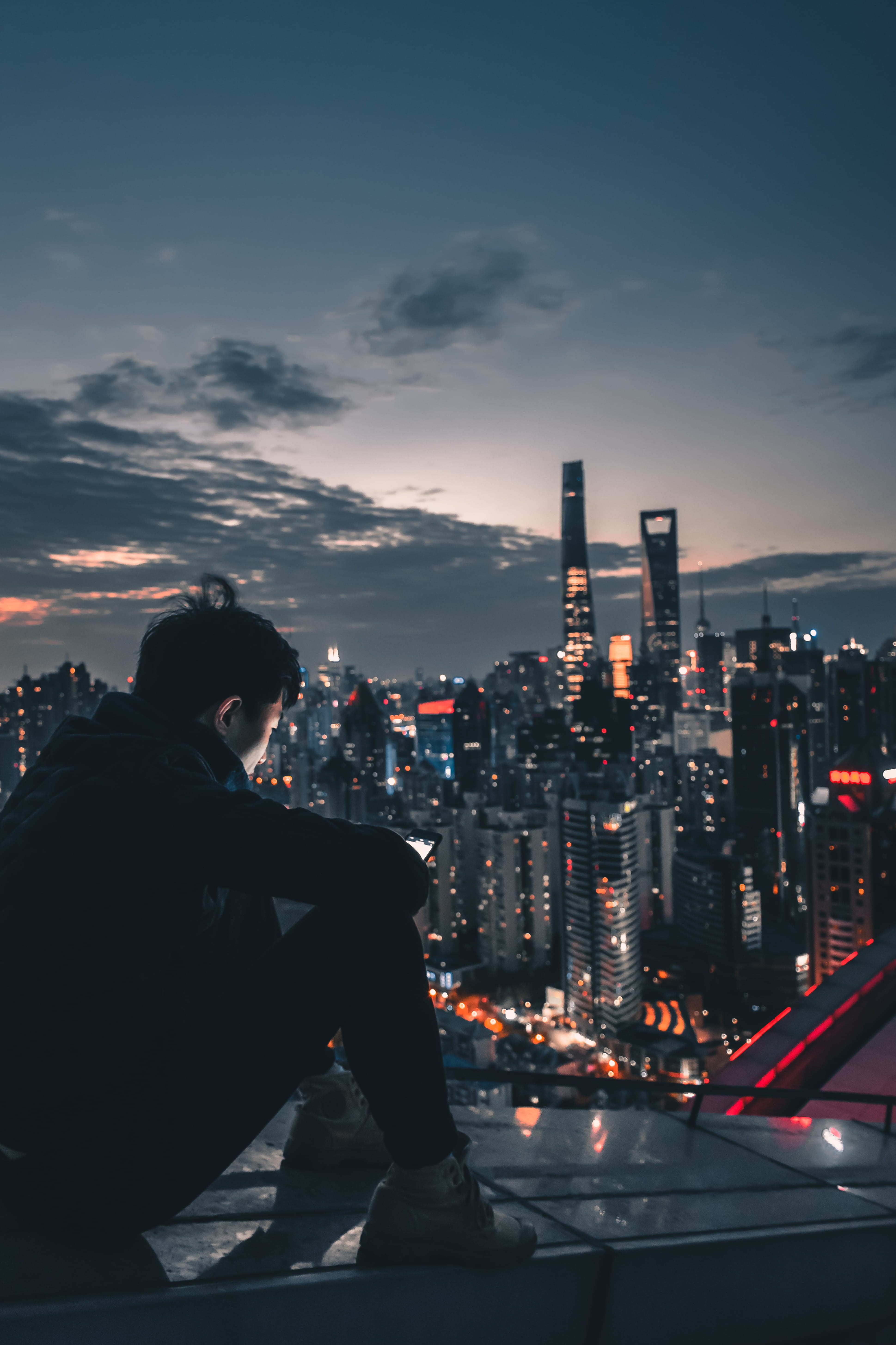 person, man, city life, modern, sitting, lifestyles, apparel, metropolis, sky, nature, city, cloud - sky, office building, cityscape, top, downtown, night, Phone HD Wallpaper