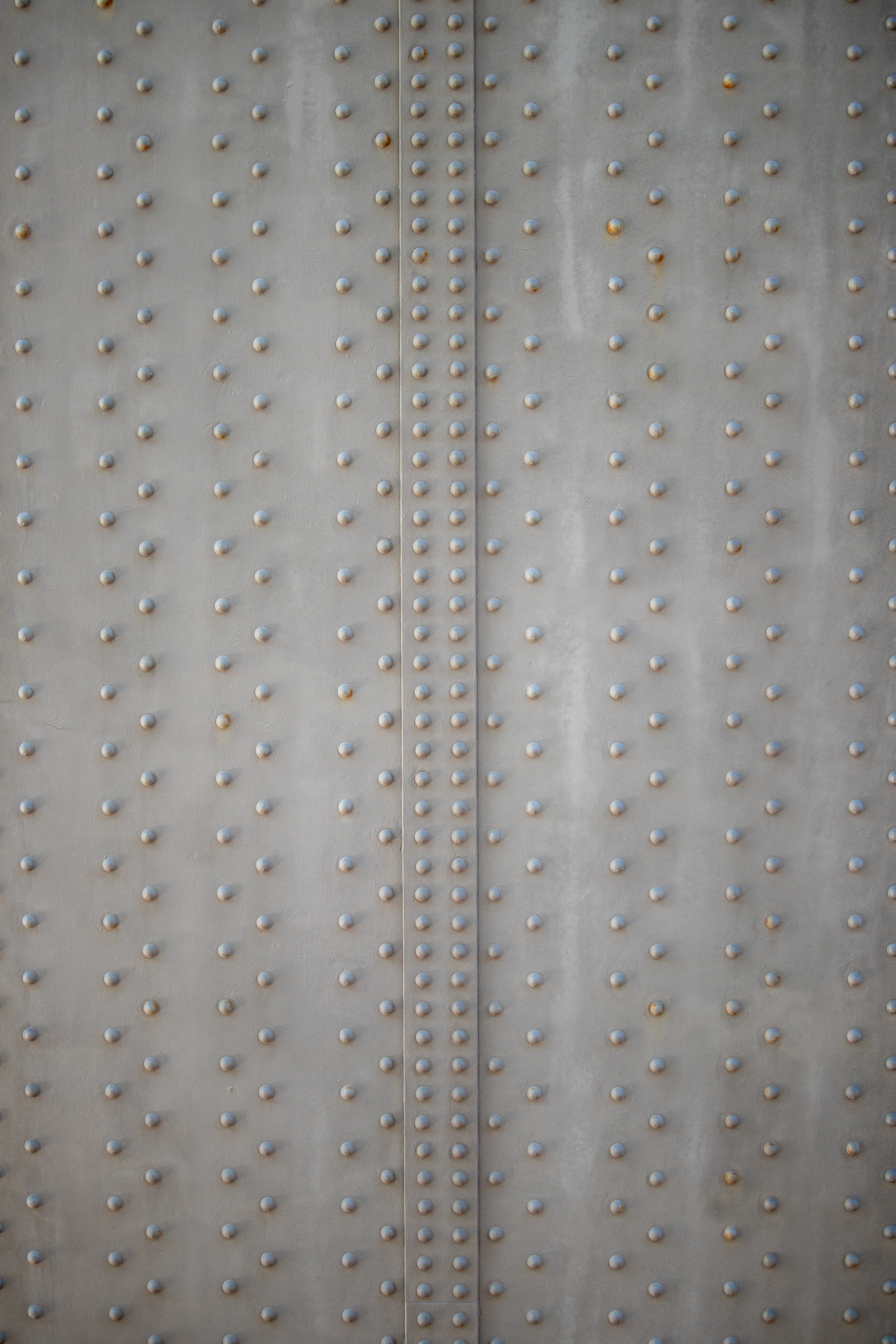 textured, day, pattern, hole, structure, architecture, wall - building feature, backgrounds, 5K, side by side, selective focus, surface, silver colored, Phone HD Wallpaper