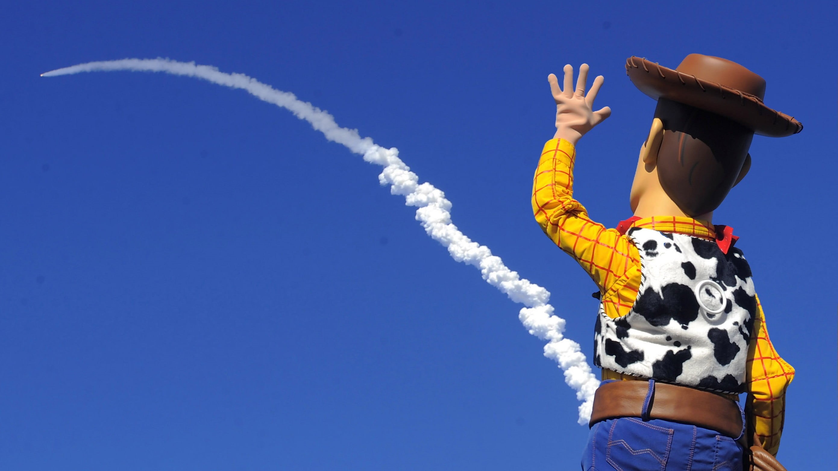 Sheriff Woody, fictional, vapor trail, airplane, woody, outdoors, flying, story, sunny, adult, mascot, blue, cloud - sky, day, hat, warm clothing, standing, HD Wallpaper