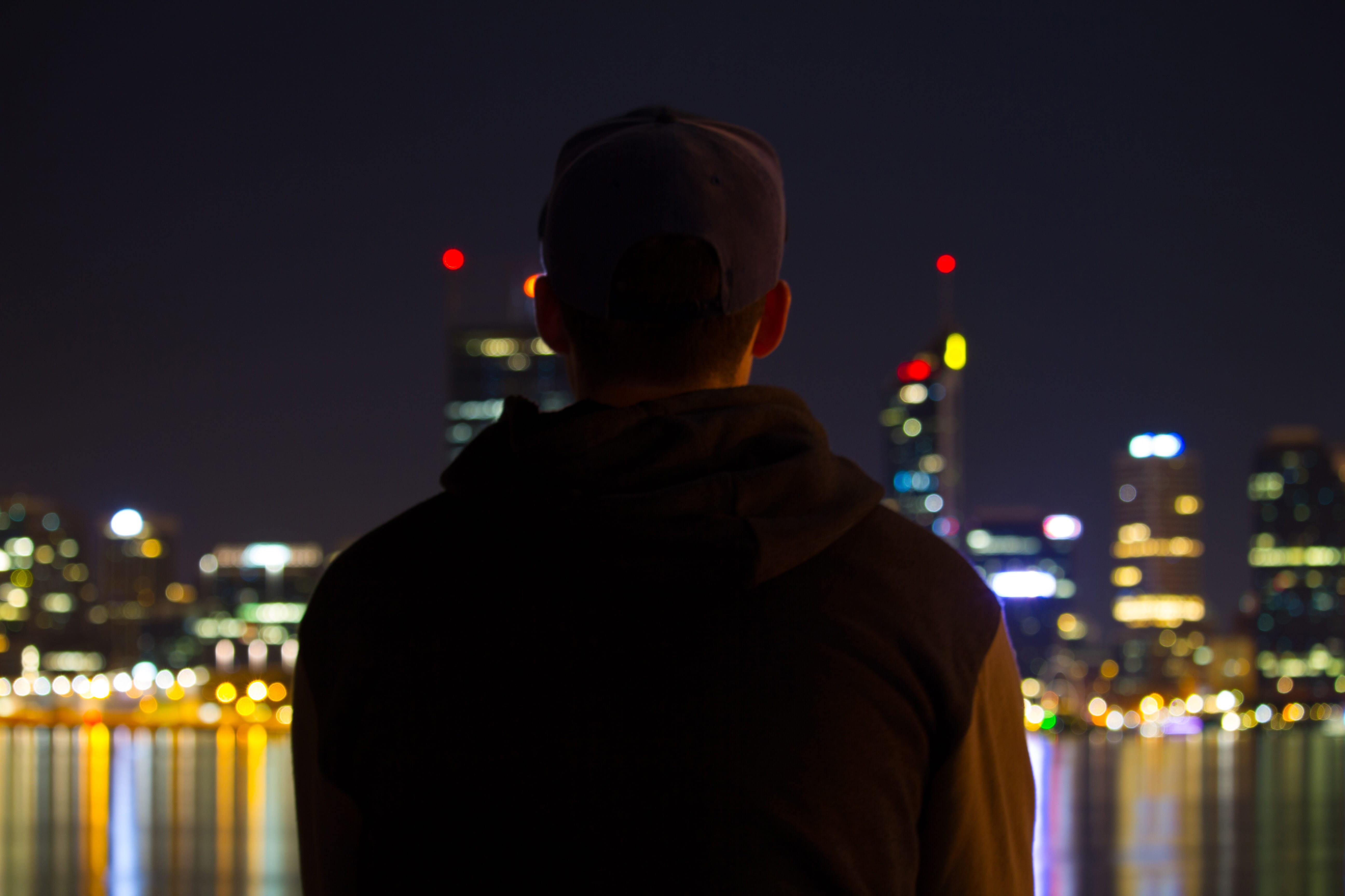 looking, built structure, cityscape, illuminated, men, headshot, rear view, looking at view, sitting, males, skyscraper, lights, city life, sky, people, HD Wallpaper