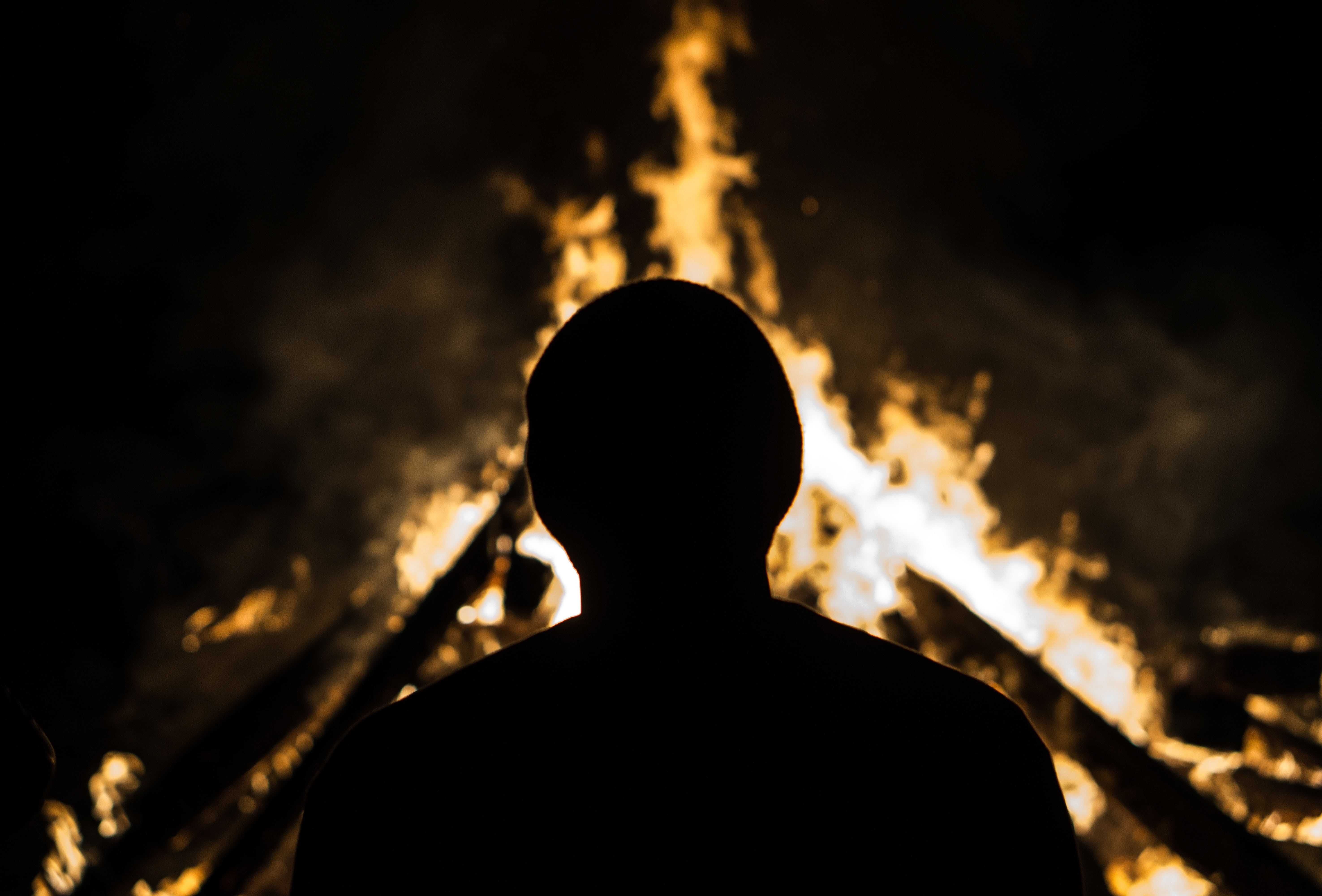 warning sign, smoke - physical structure, silhouette, one person, flame, bonfire, hot, photography, risk, people, dark, headshot, standing, firewood, light, HD Wallpaper