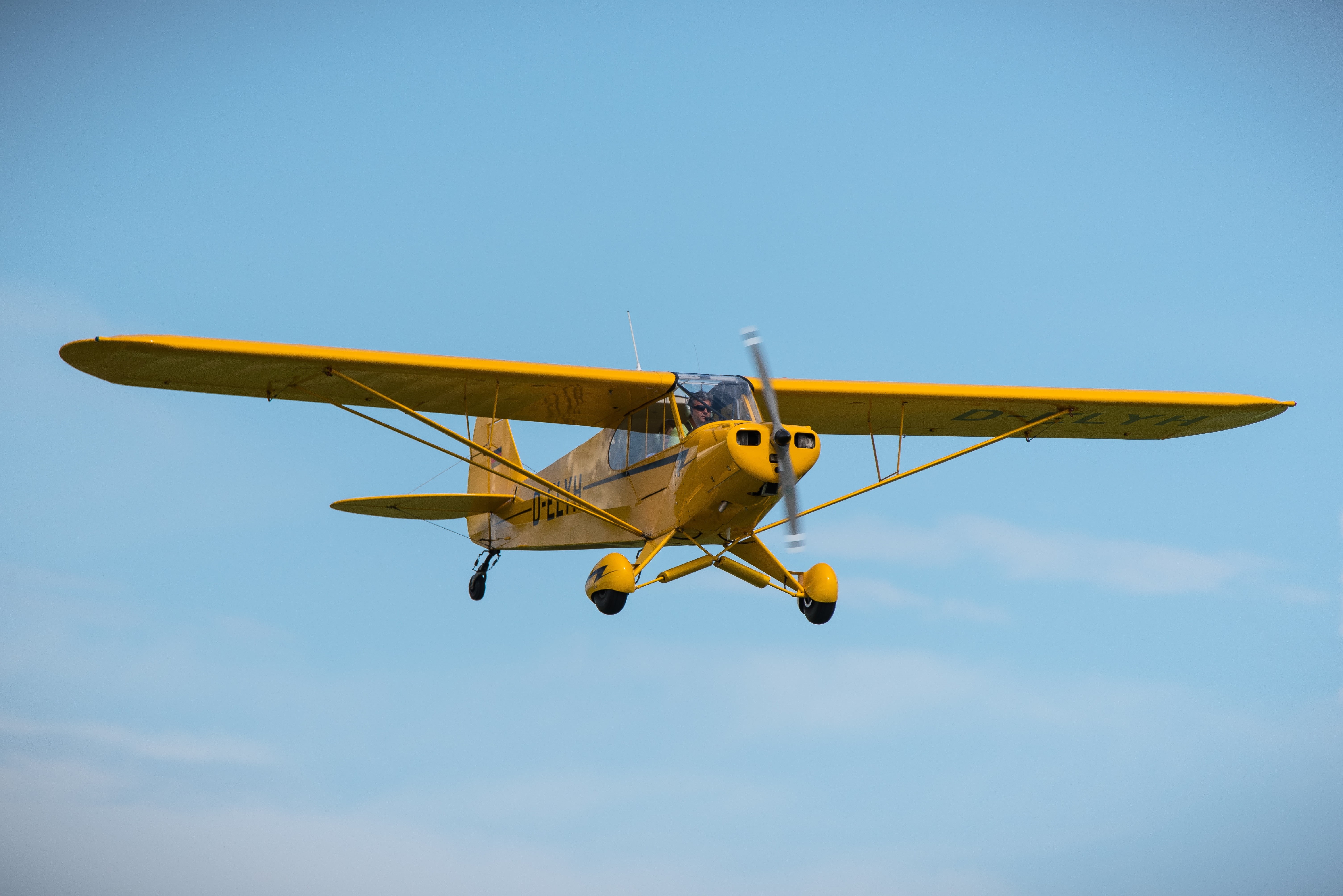 aerospace industry, clear sky, person, mid-air, travel, day, blue, outdoors, no people, flying, piper cub, yellow, on the move, nature, copy space, riding, HD Wallpaper