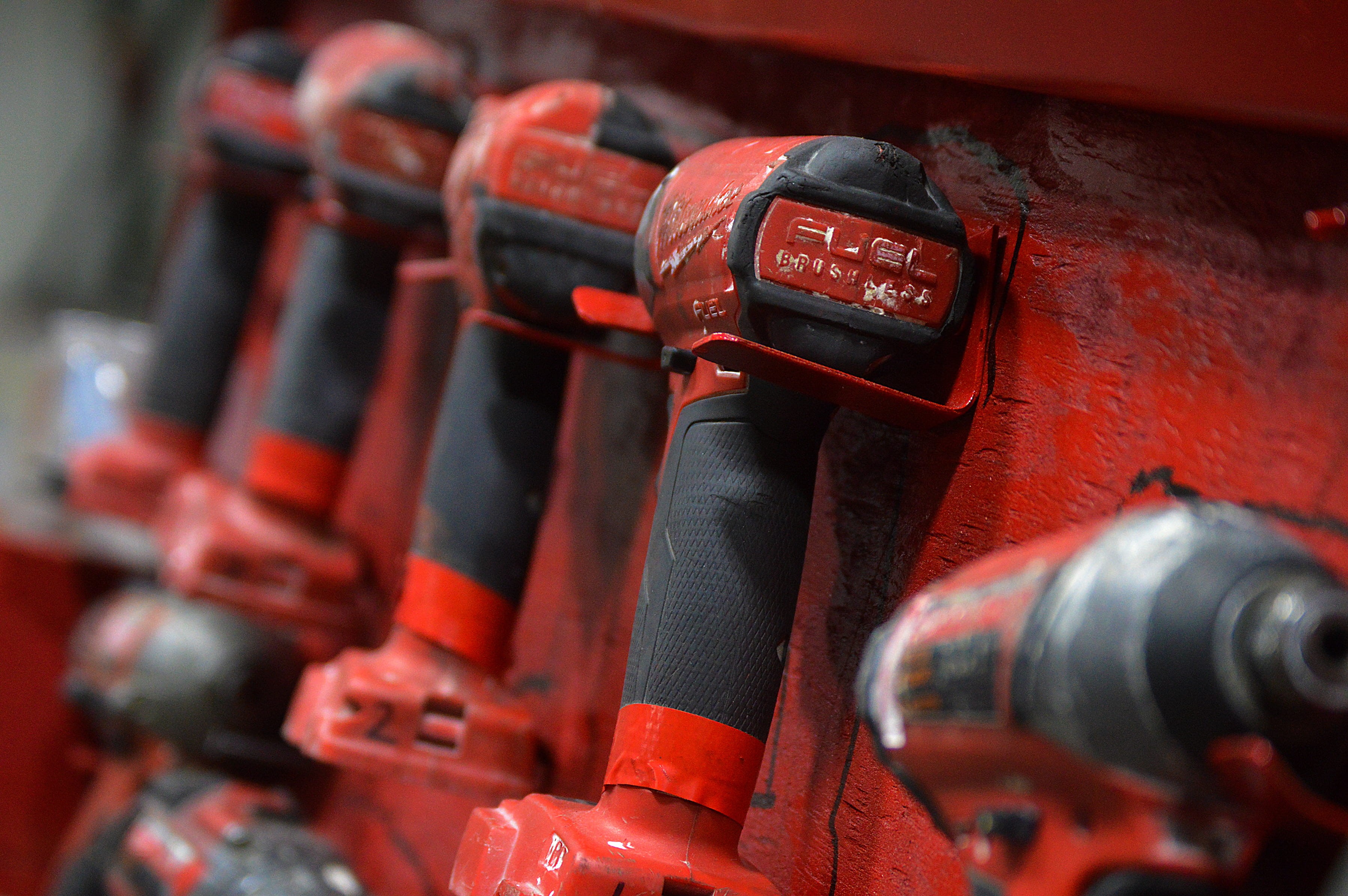 drills, battery power, control, connection, factory, metal, 2K, machine valve, mode of transportation, power drill, red tools, transportation, in a row, HD Wallpaper