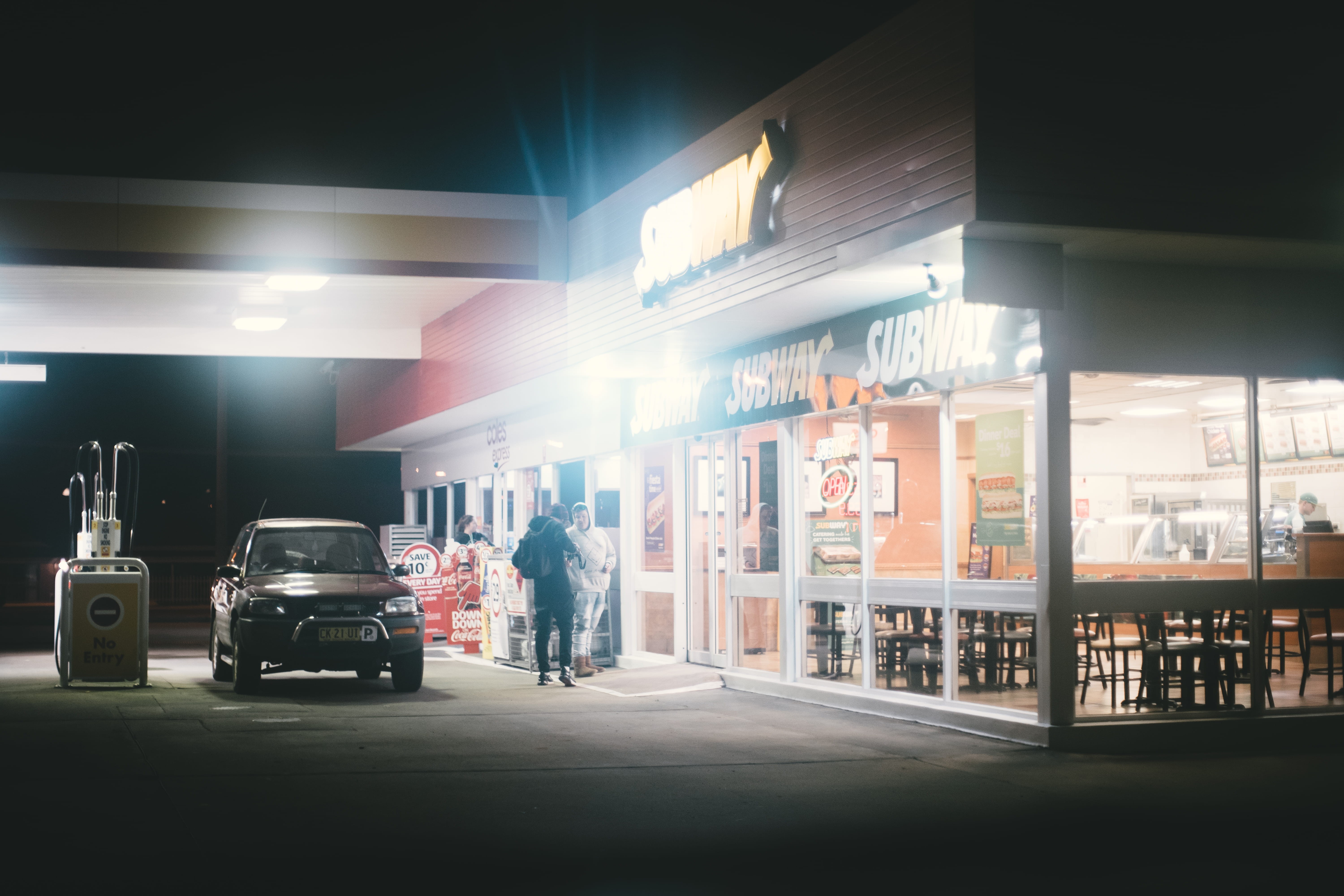 incidental people, sedan, full length, two, rear view, built structure, gas station, subway, black, street, one person, city, light, building, person, urban, HD Wallpaper