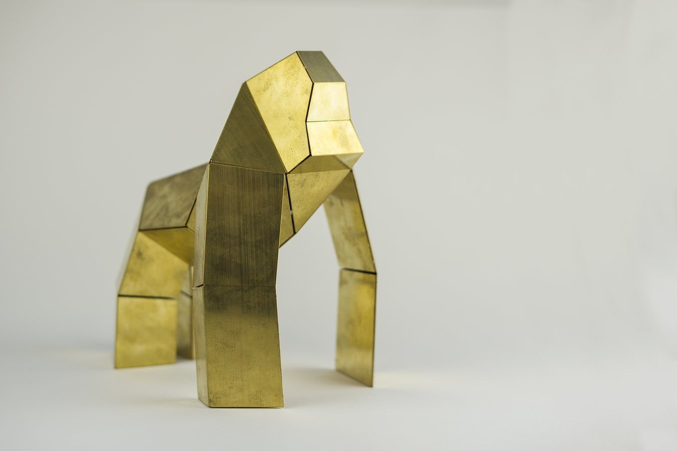 yellow, studio shot, gorilla, ingot, sculpture, no people, geometric, close-up, table, still life, gray background, pattern, figurine, art and craft, metal, HD Wallpaper