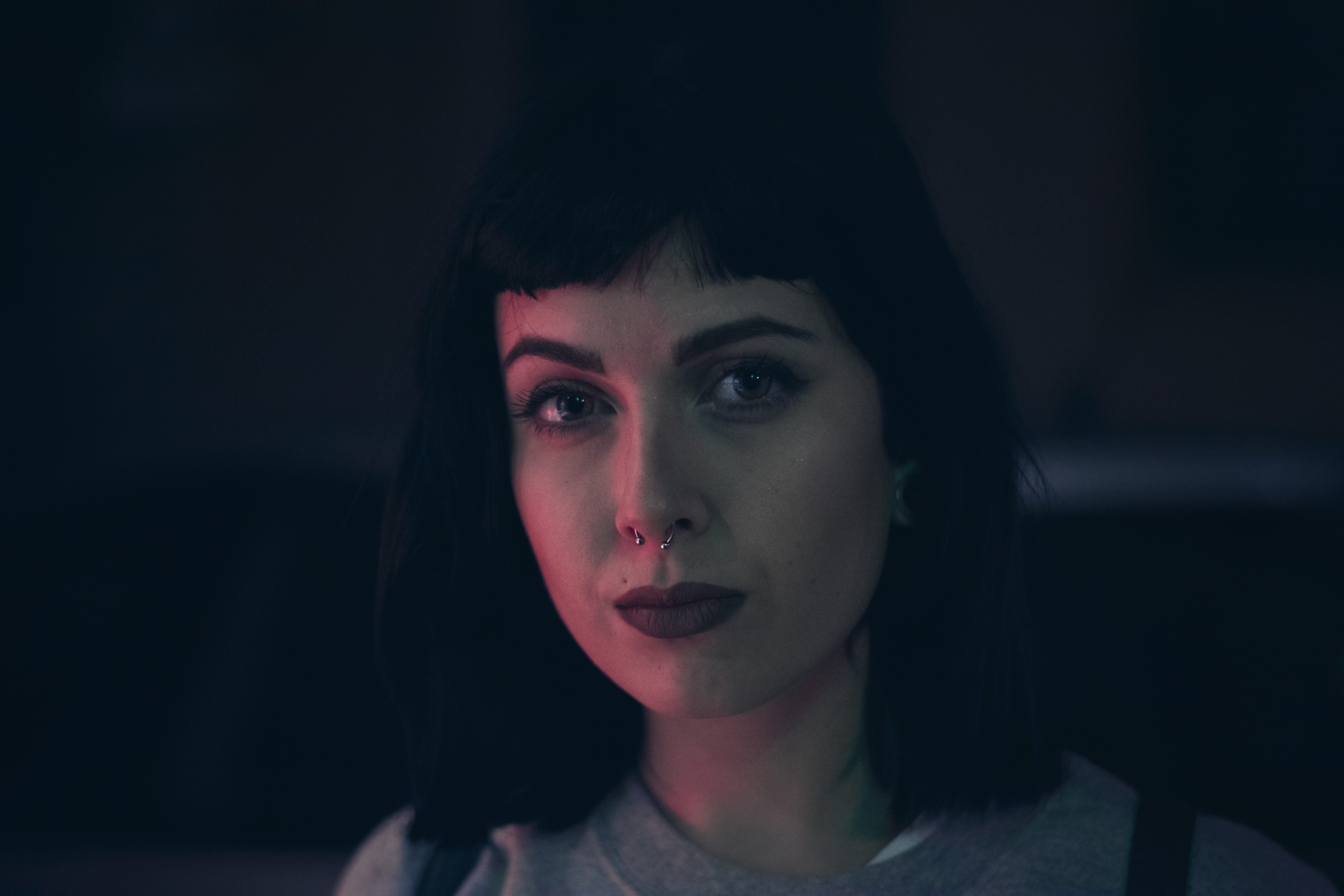 night, looking at camera, close-up, contemplation, front view, headshot, portrait, nose ring, young women, photography, women, face, dark, one person, beautiful woman, HD Wallpaper