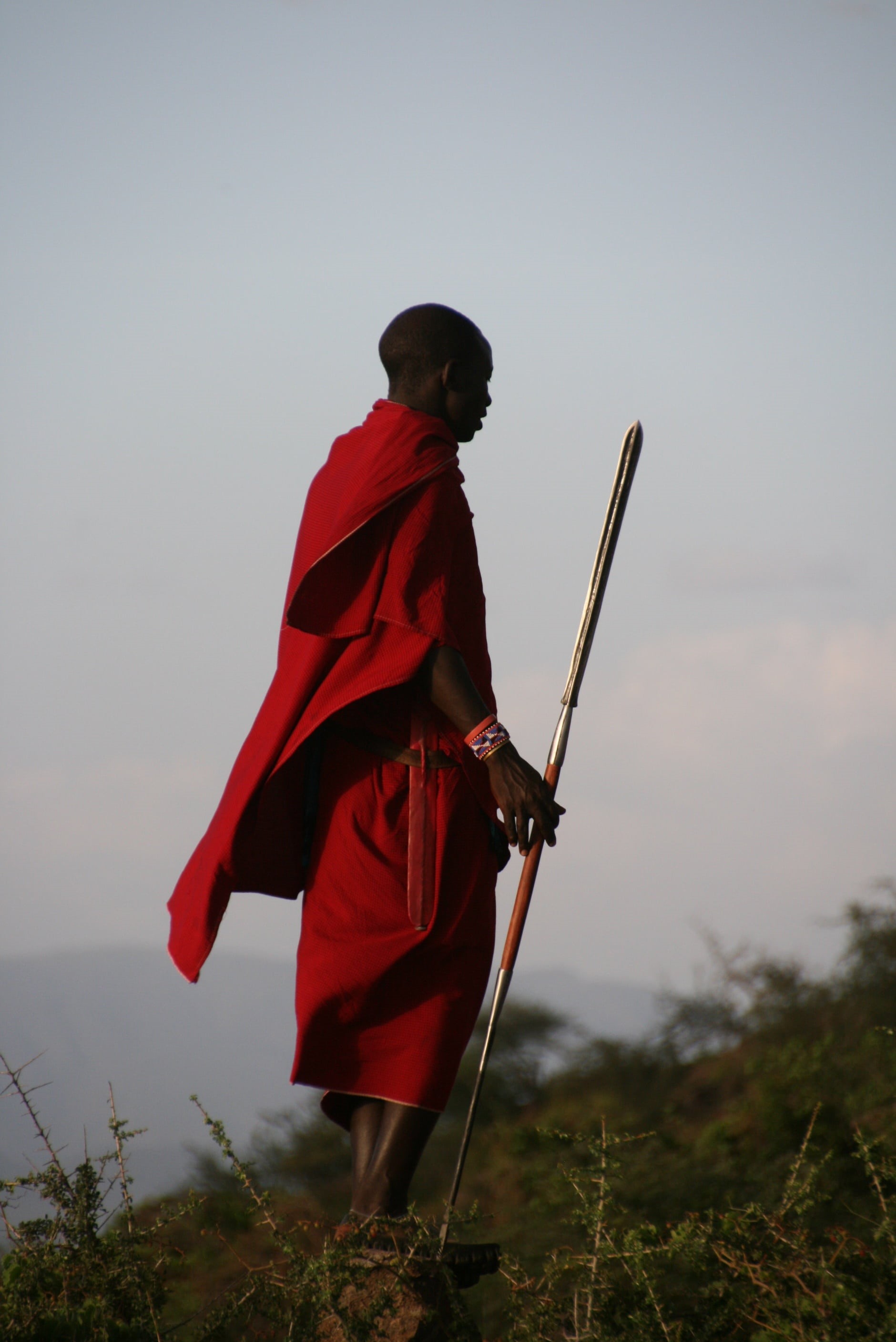 beauty in nature, gray, full length, day, wearing, sky, focus on foreground, daytime, standing, holding, spear, tanzania, nature, people, one Person, man, Phone HD Wallpaper