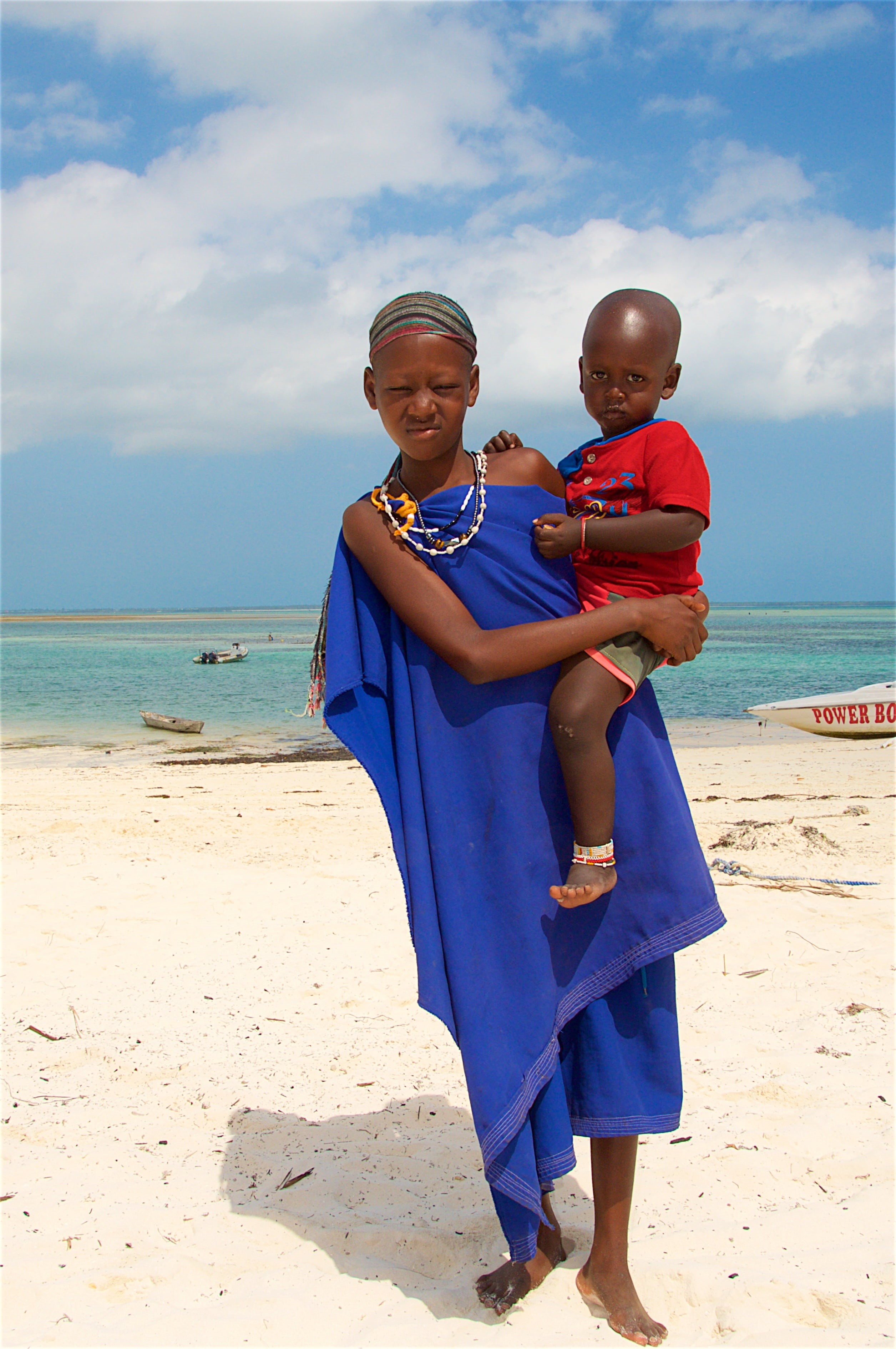 mature women, africa, males, childhood, outdoors, baby, looking at camera, day, sand, vacations, sky, zanzibar, beach, land, child, woman with a child, Phone HD Wallpaper