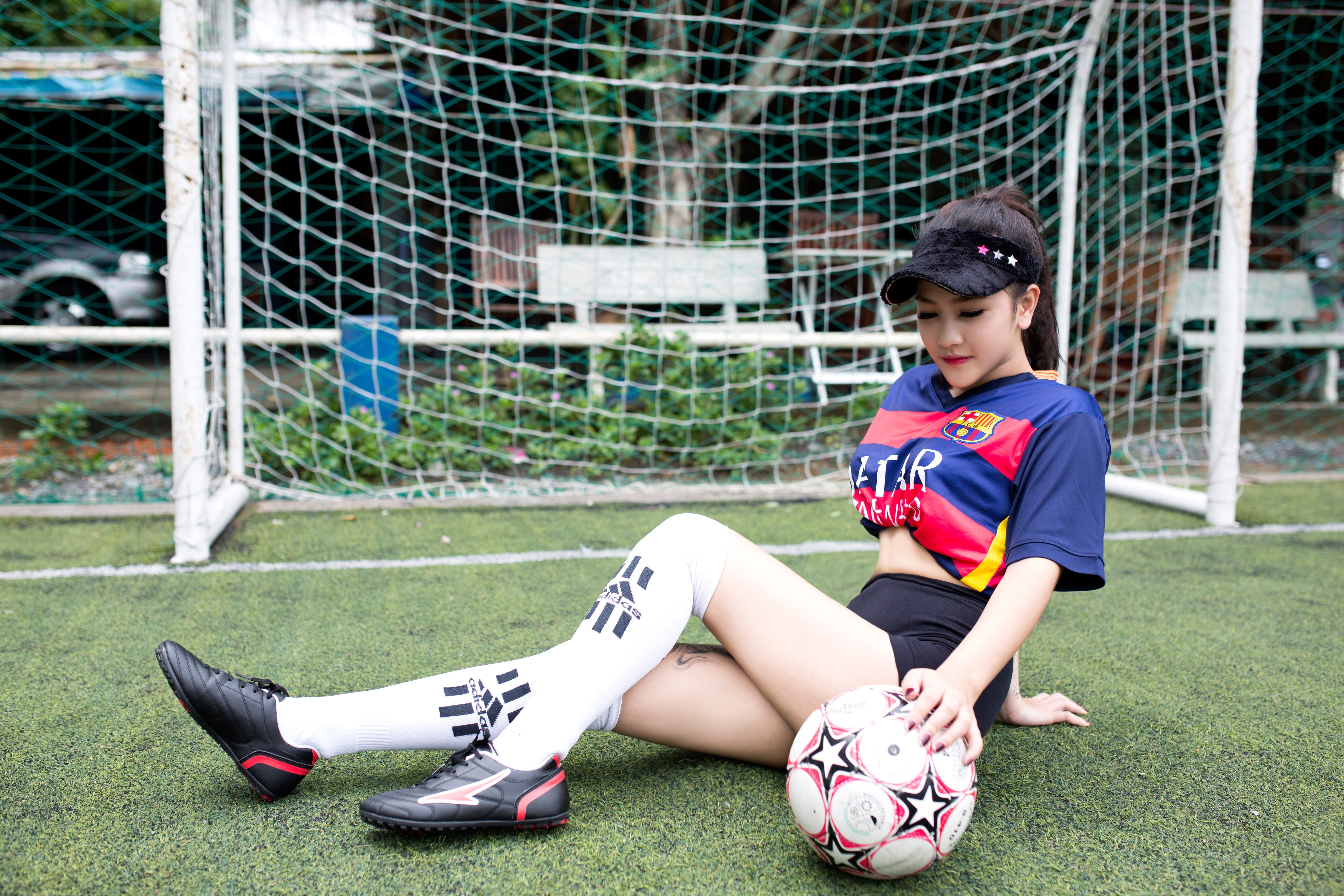 day, real people, outdoors, sport, red, looking, one person, nature, blue, Football, goal, green, t, jersey, child, people, Girl, sports uniform, shoe, HD Wallpaper