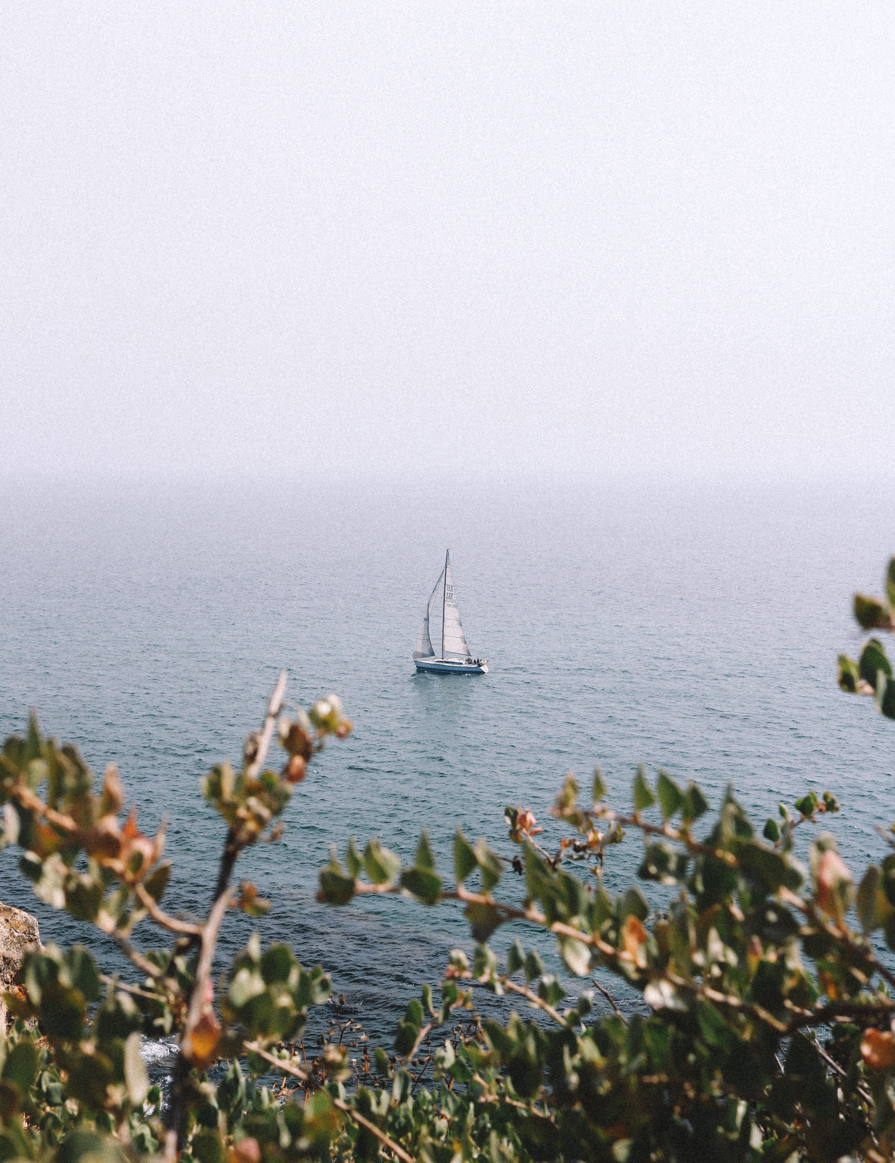 cliff, navigate, tranquil scene, boat, sailboat, sail, vacation, fog, beauty in nature, sailship, copy space, mode of transportation, nature, seaside, sea, Phone HD Wallpaper