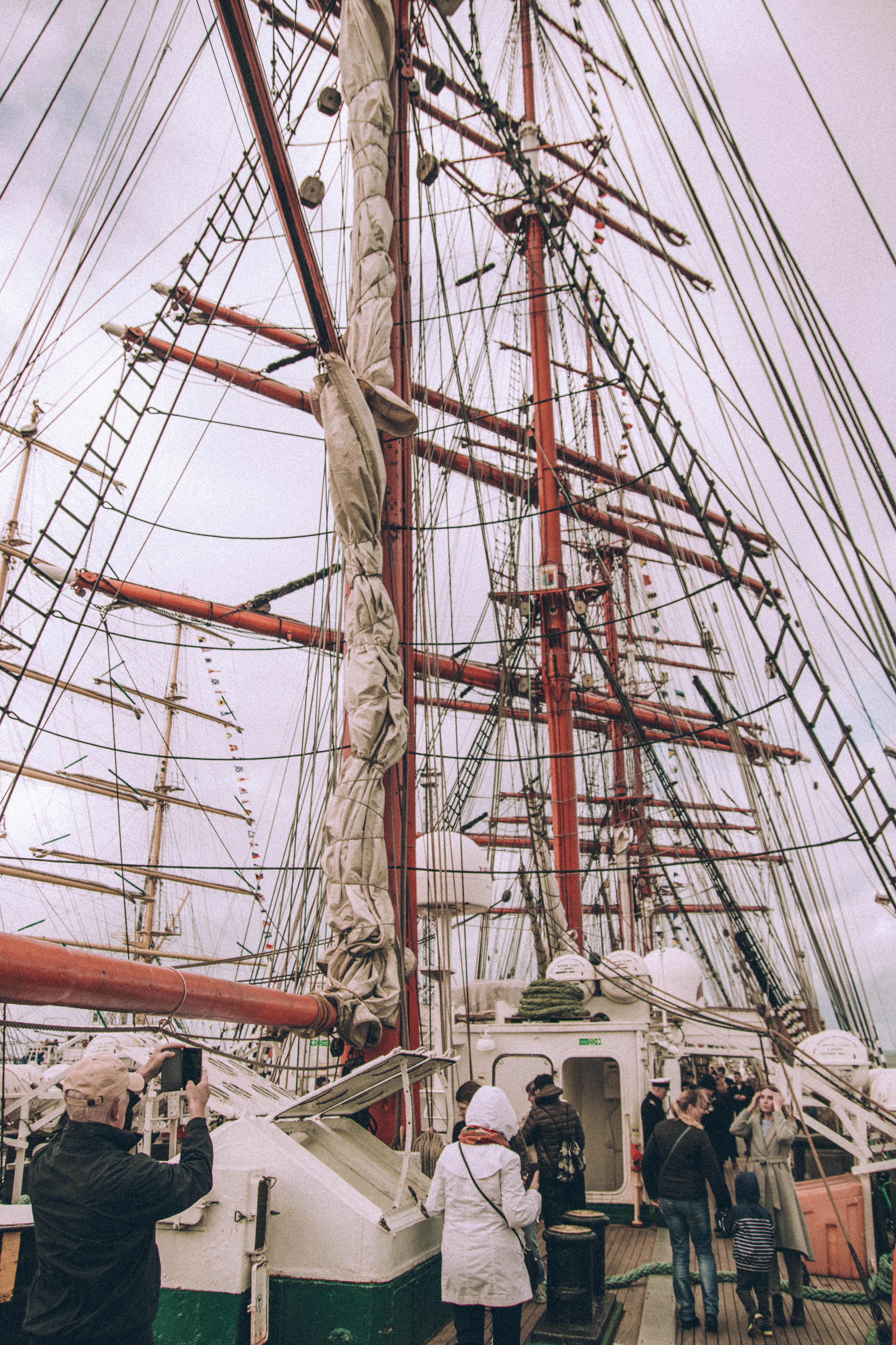 real people, daytime, steel, sailboat, men, built structure, sail, mast, women, watercraft, ropes, sailship, group of people, 5K, lifestyles, adult, transportation system, Phone HD Wallpaper