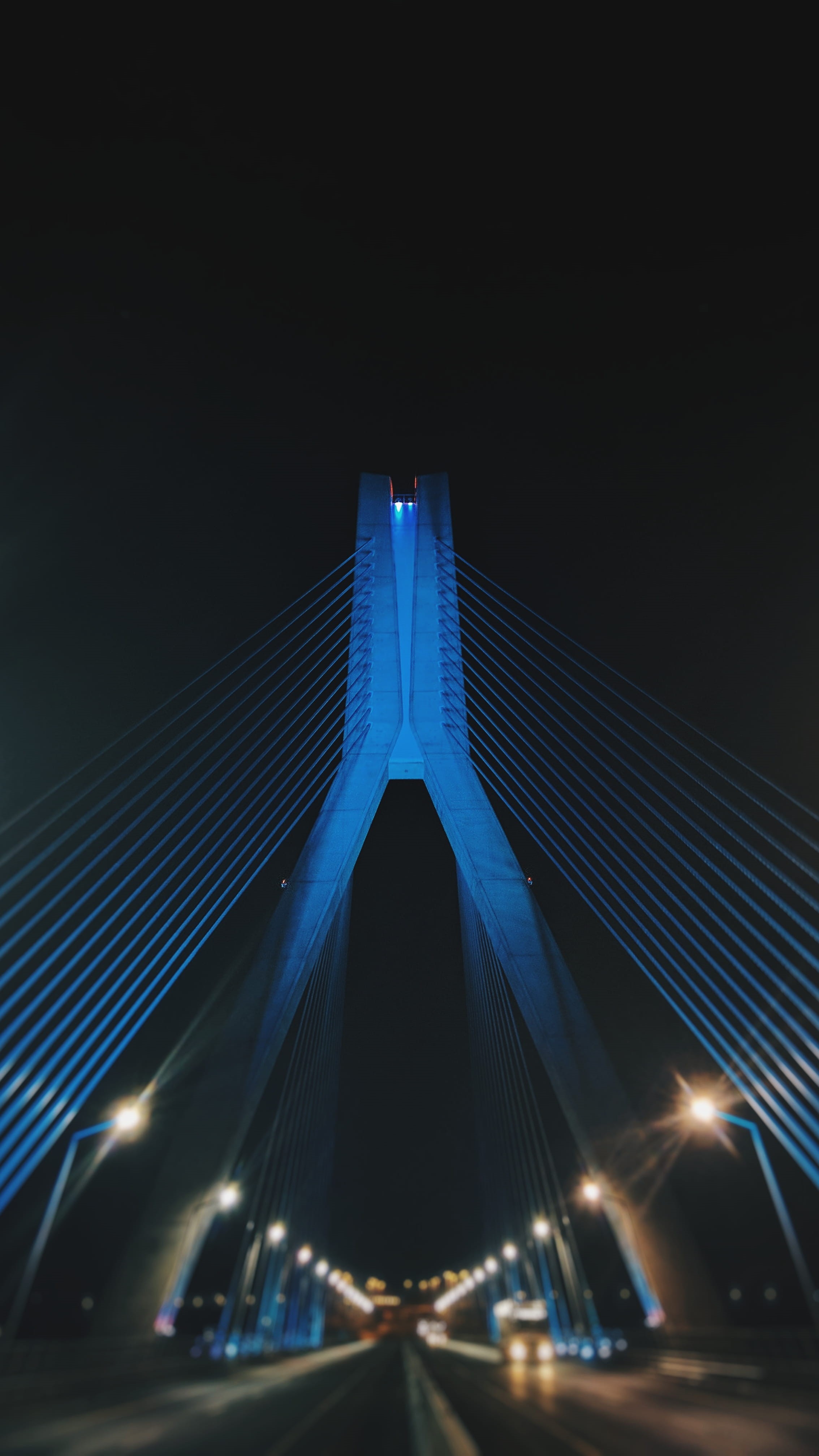 traffic, low angle view, sky, blur, cable-stayed Bridge, bridge, urban Scene, famous Place, daytime, skyscraper, photography, shallow, steel Cable, blue, Phone HD Wallpaper