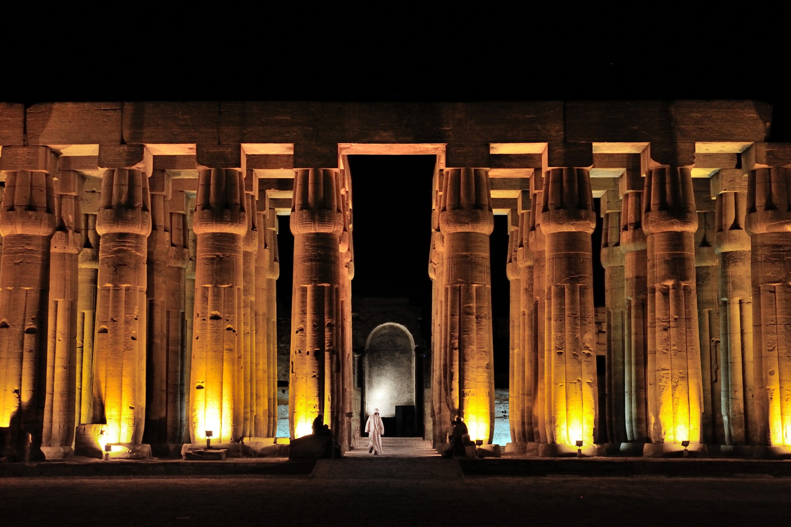 concrete, architectural column, Thebes, illuminated, monument, historic, indoors, old, standing, night, egyptian, man, light, tourism, in a row, archaeology, HD Wallpaper