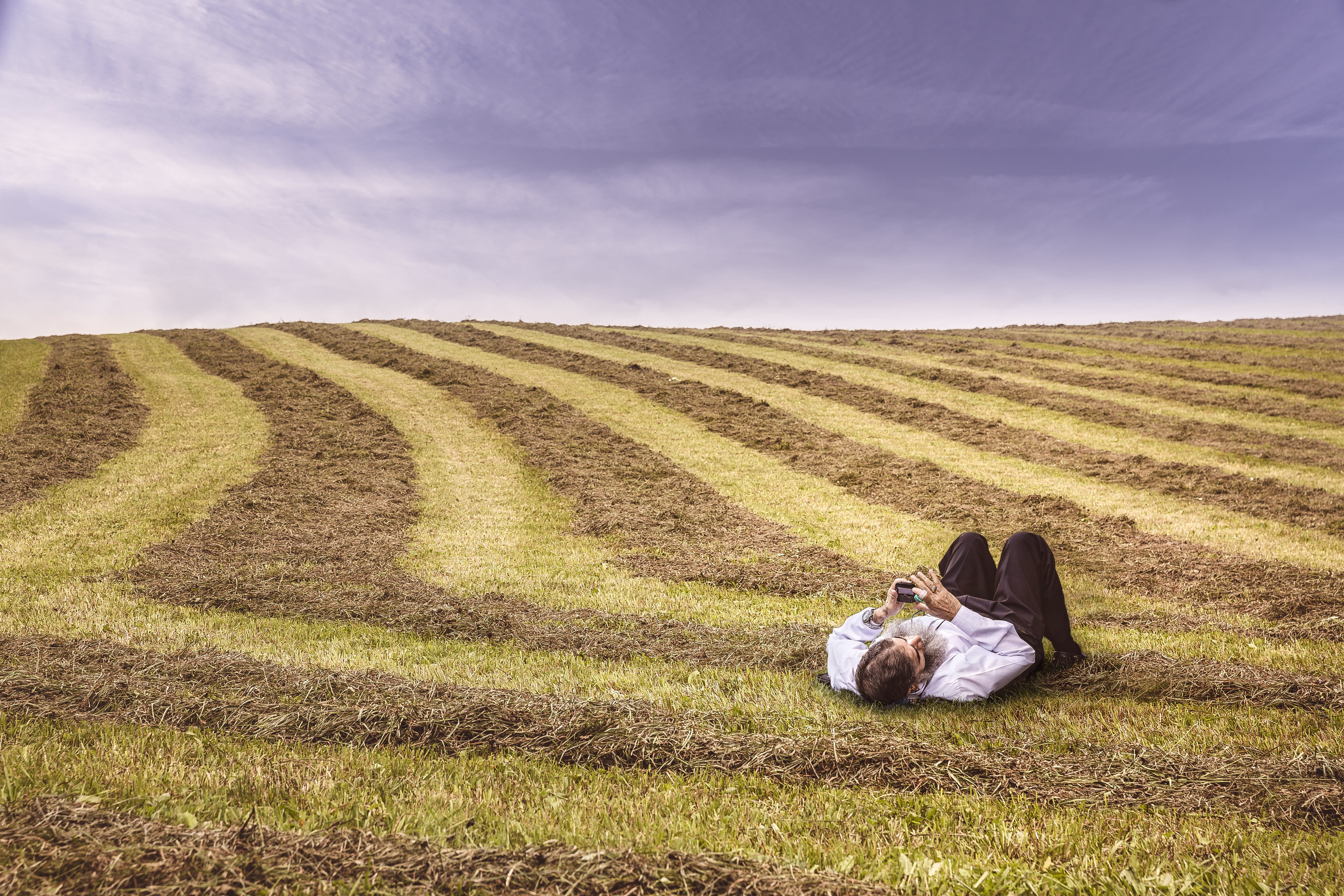 beard, working, dress, summer, hill, environment, relaxation, lying, adult, man, landscape, green grass, down, rural Scene, nature, laying, pants, dress shirt, HD Wallpaper