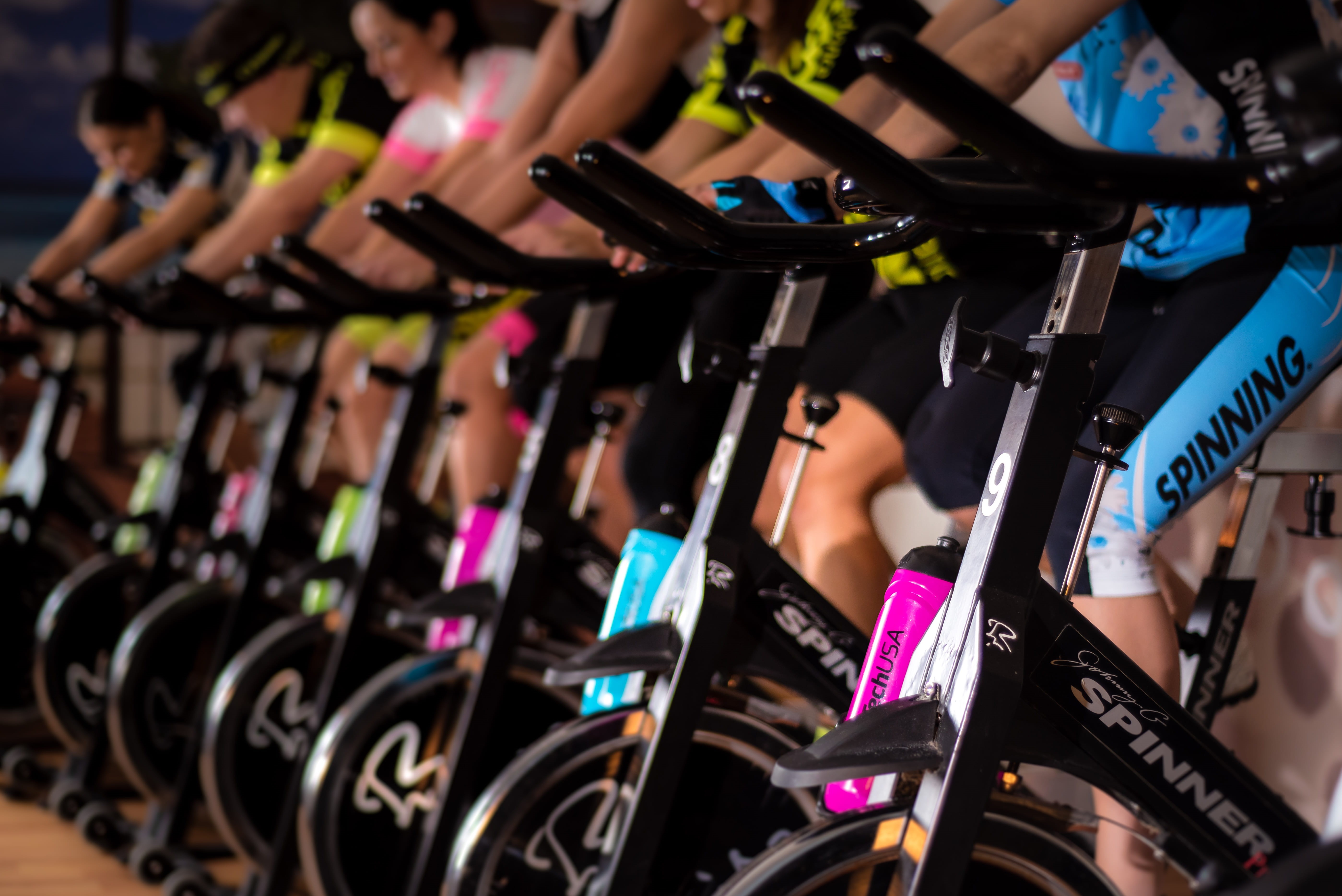 cycle, bicycle, person, multi colored, human body part, wheel, spinning, arts culture and entertainment, equipment, class, night, adult, gym, transportation, HD Wallpaper