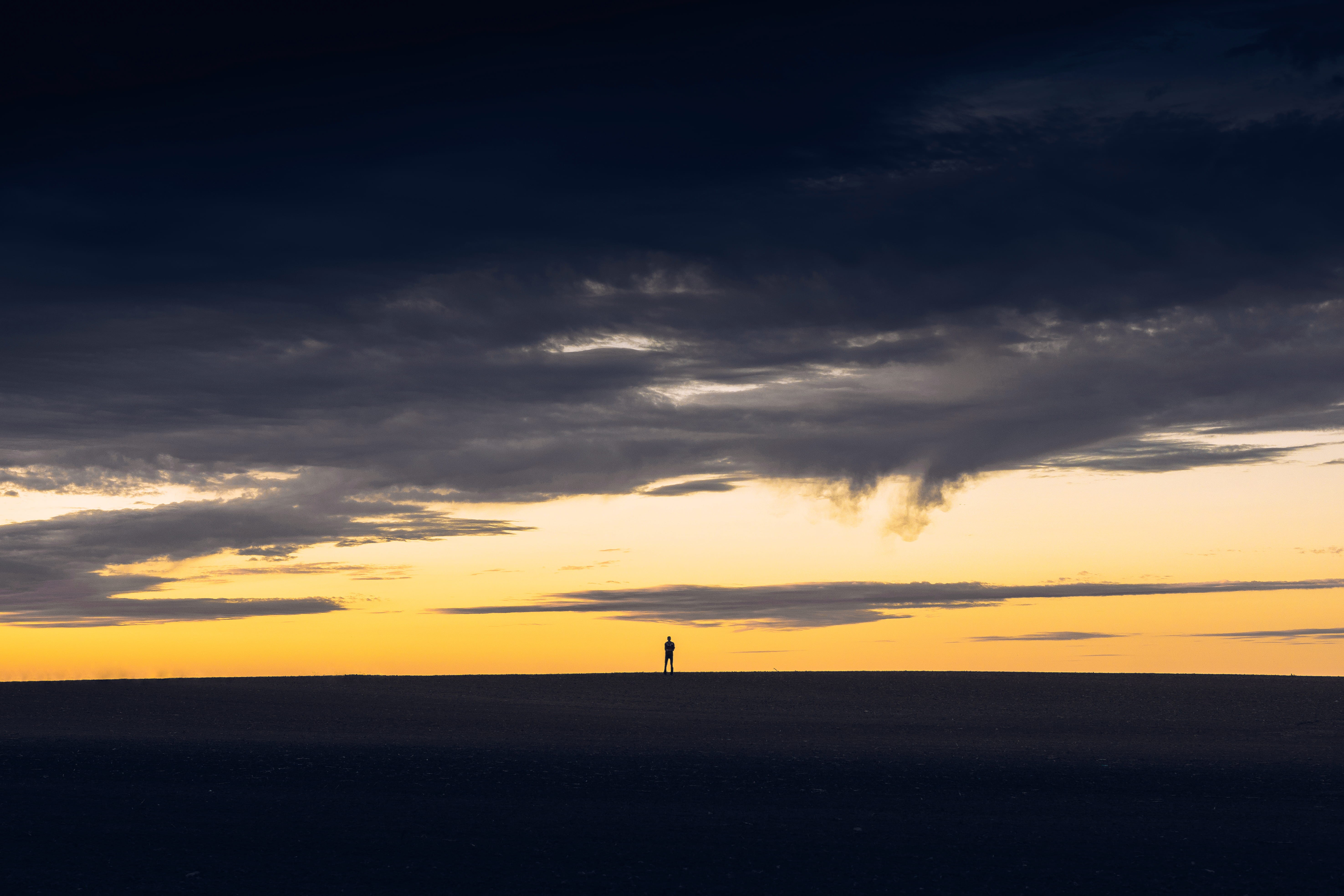 person, cloudscape, golden, idyllic, standing, cloud - Sky, dramatic sky, orange color, no people, water, sunlight, tranquil scene, 5K, horizon over water, HD Wallpaper
