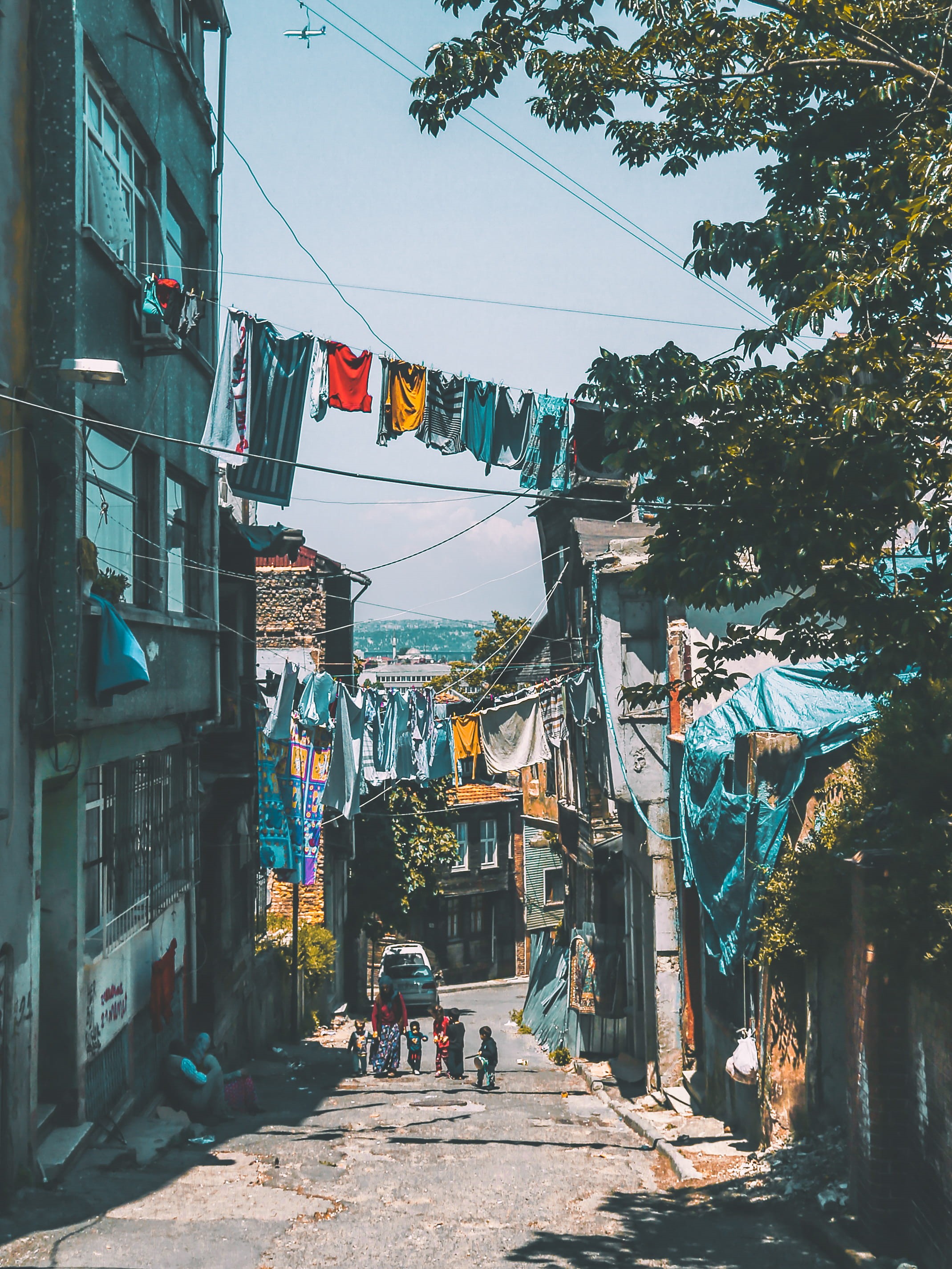 incidental people, city, exterior, sky, green, tourism, residential district, near, nature, clothes, cable wires, day, leafed, footpath, building exterior, Phone HD Wallpaper