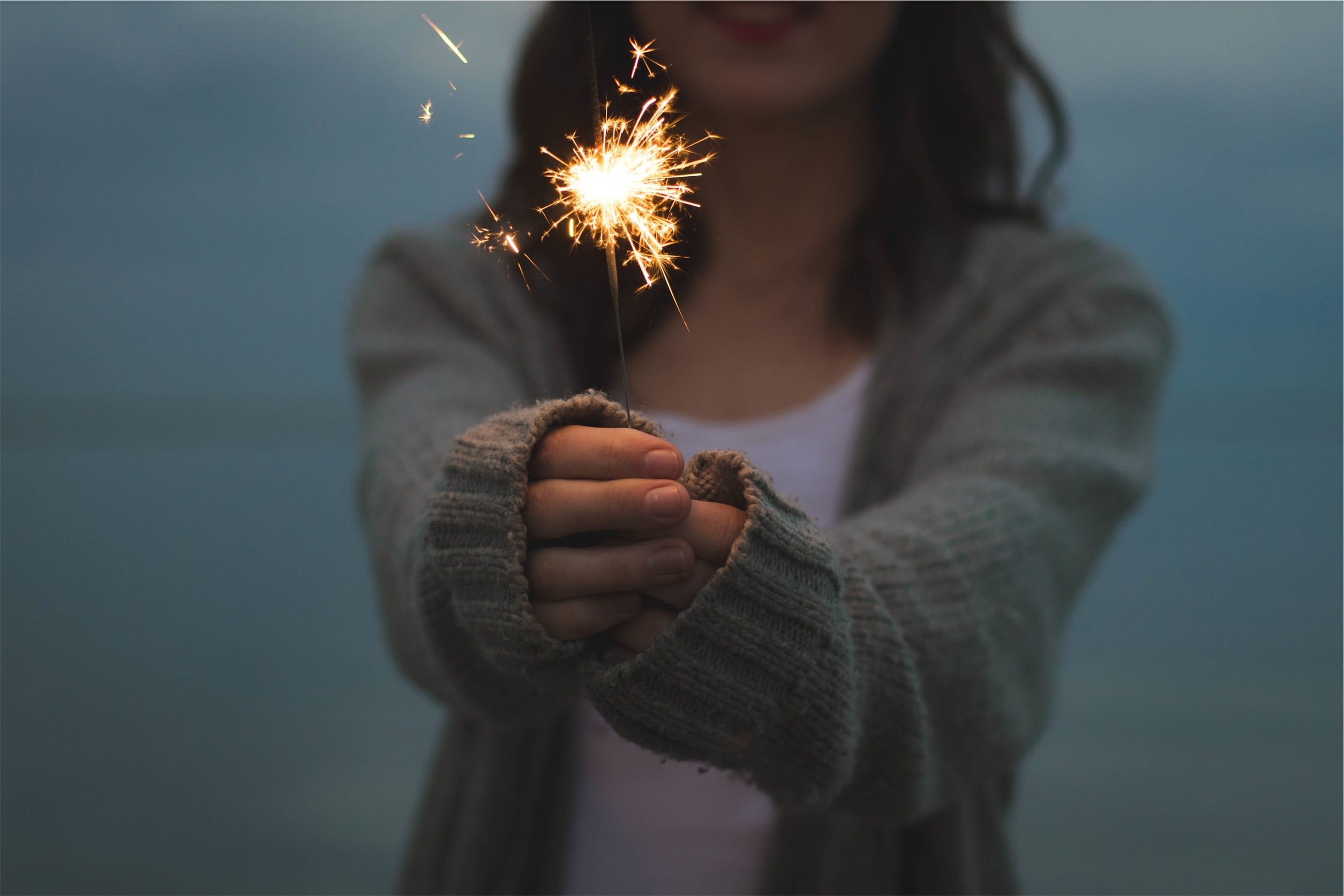 hands, blurred motion, motion, woman, new years eve, bright, sparkler, front view, cardigan, party, girl, holding, long exposure, burning, arts culture and entertainment, HD Wallpaper
