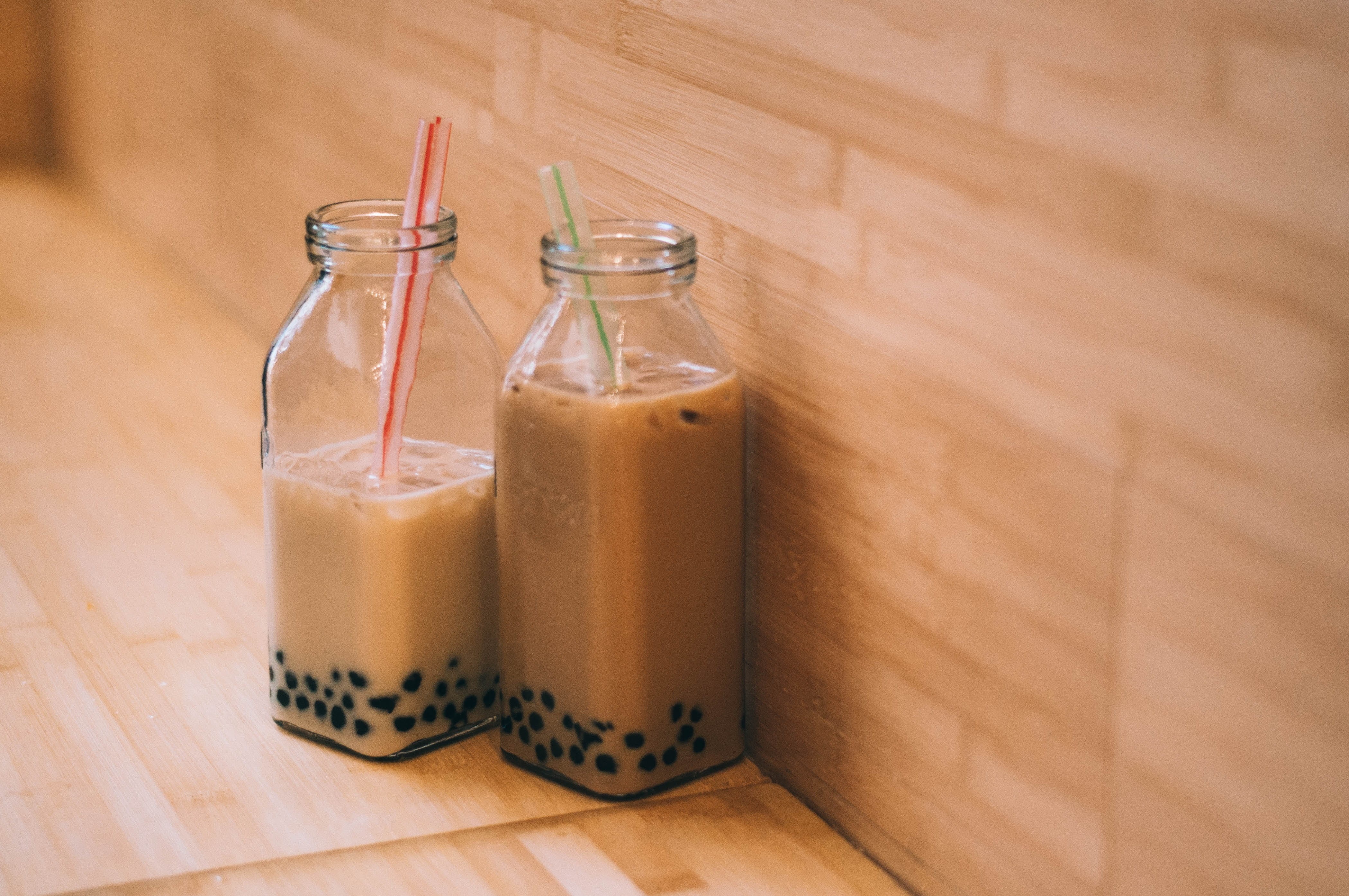 fudge, milk tea, dairy product, wood - material, food, domestic room, chocolate, milk, smoothie, bottle, boba, asian, dessert, table, straws, cafe, beverage, HD Wallpaper