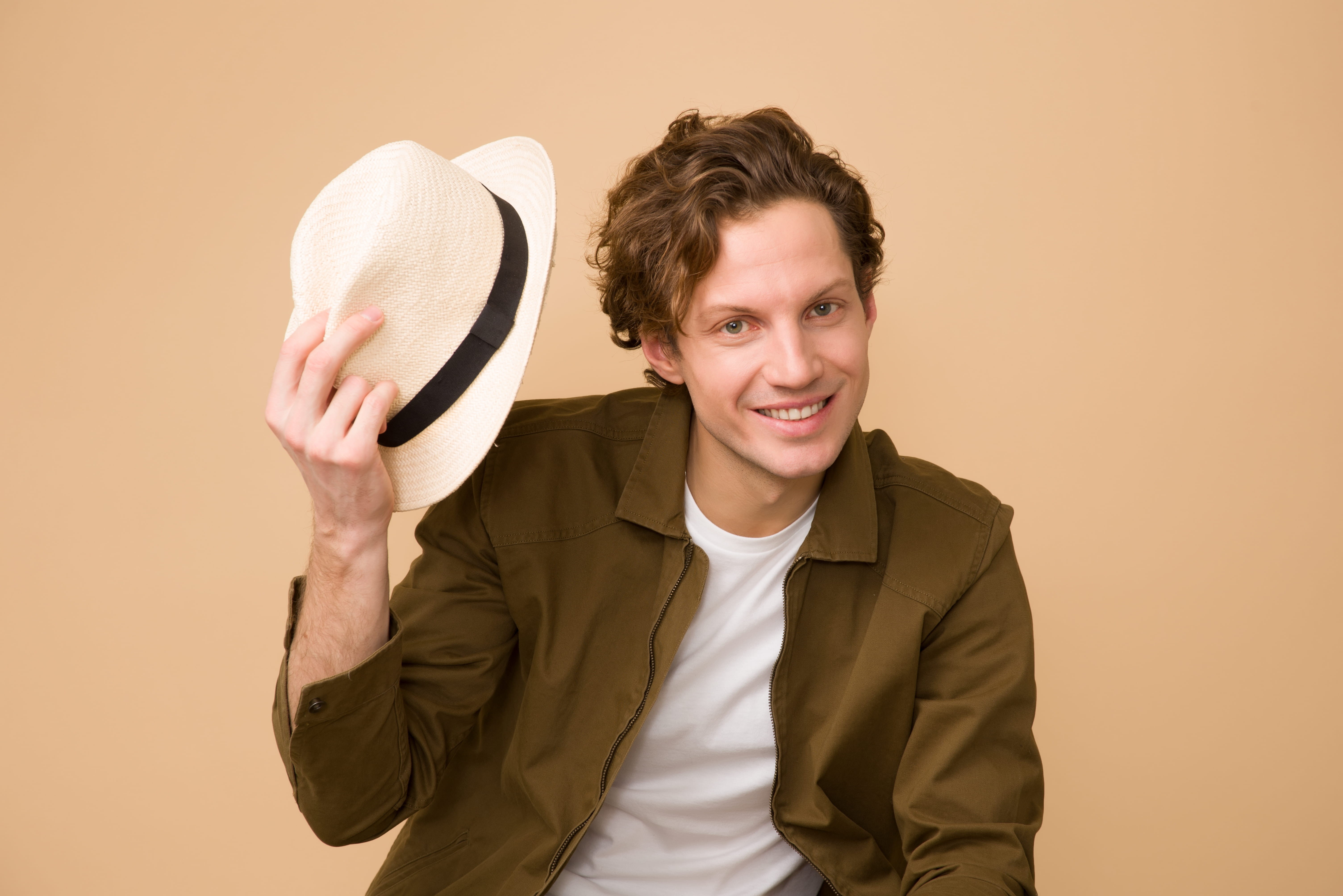 fun, happiness, holding, facial expression, young men, fashion, person, men, studio, smiling, looking at camera, colored background, wear, one person, looking, HD Wallpaper