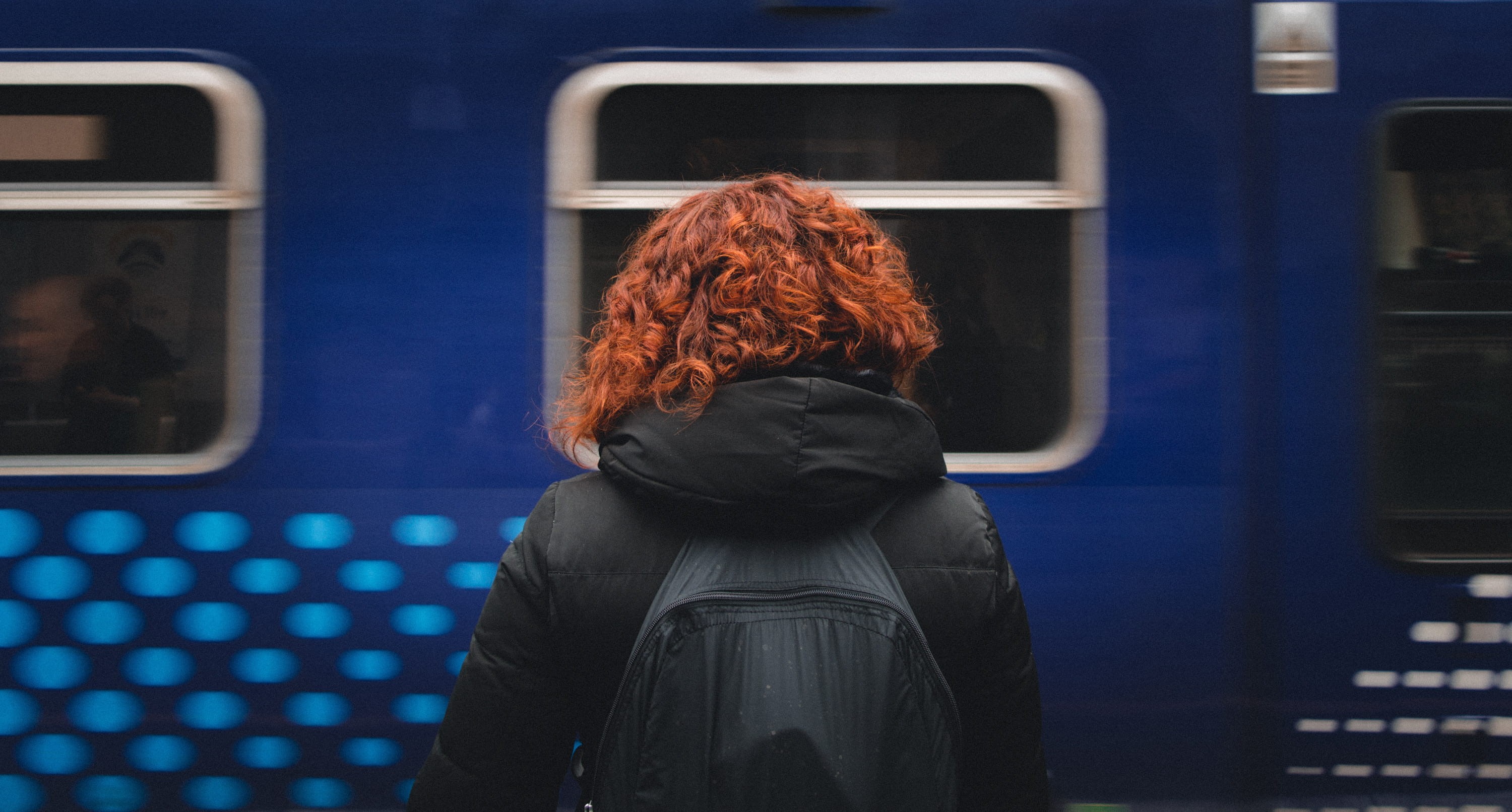 daytime, travel, woman, black, jacket, hooded, station, blue train, hairstyle, hood - clothing, wearing, adult, real people, mode of transportation, train - vehicle, HD Wallpaper