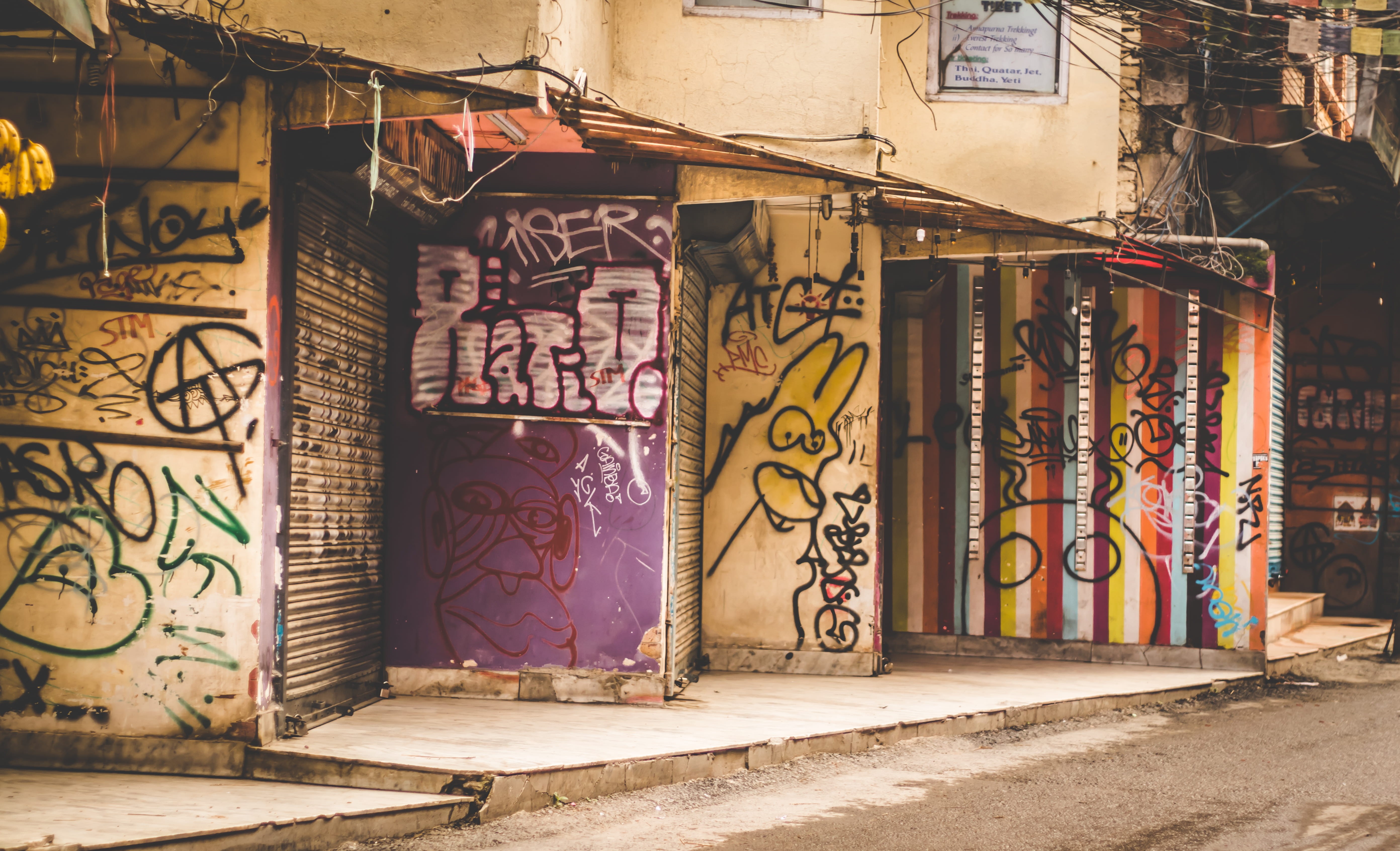 wall, entrance, bus stop, daytime, brick, building, building exterior, no people, housing, text, wall - building feature, white, graffitis, town, architecture, HD Wallpaper