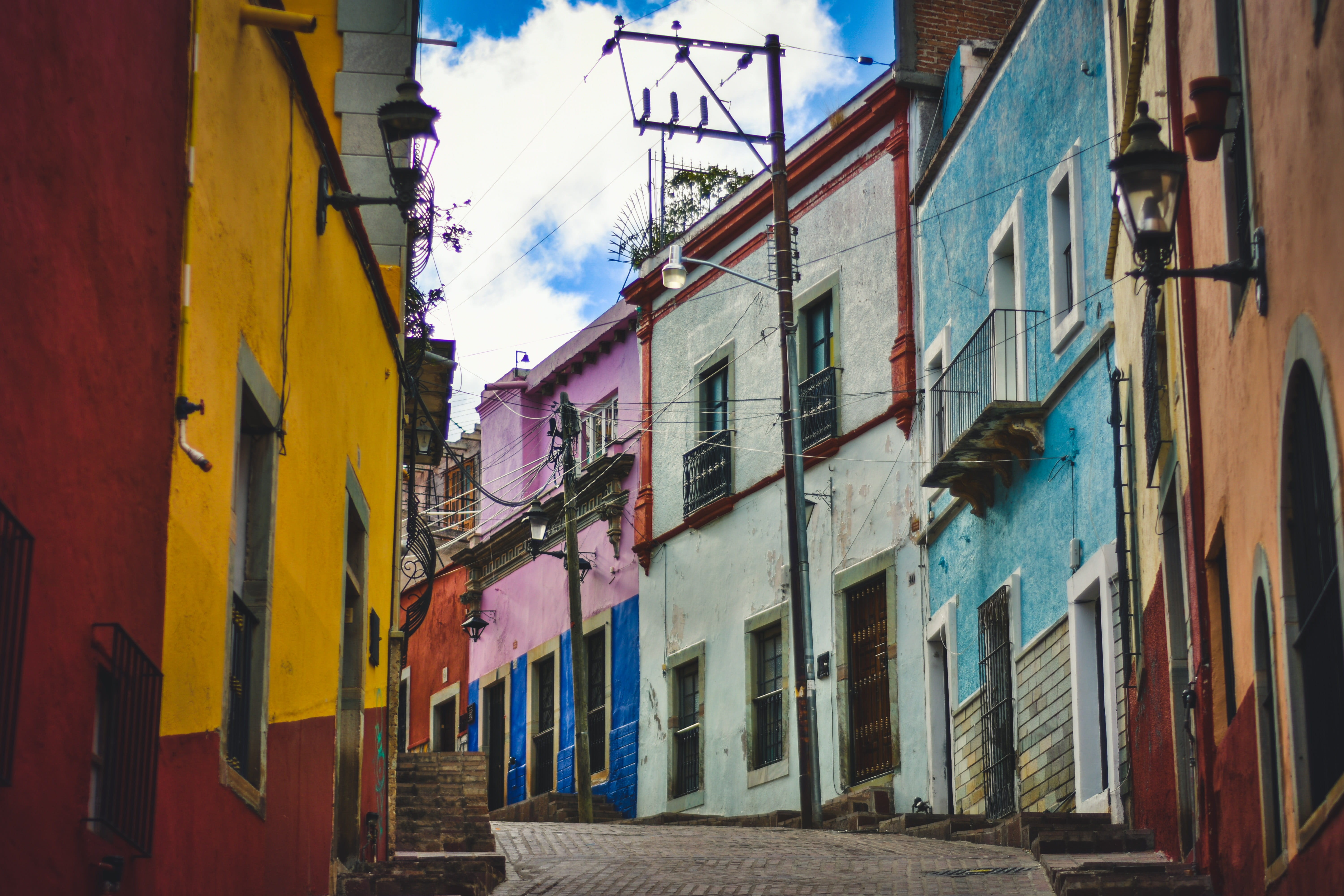 multi colored, apartment, yellow, sky, building exterior, colonial, city, phoneline, alleyway, built structure, no people, mexico, day, residential district, HD Wallpaper