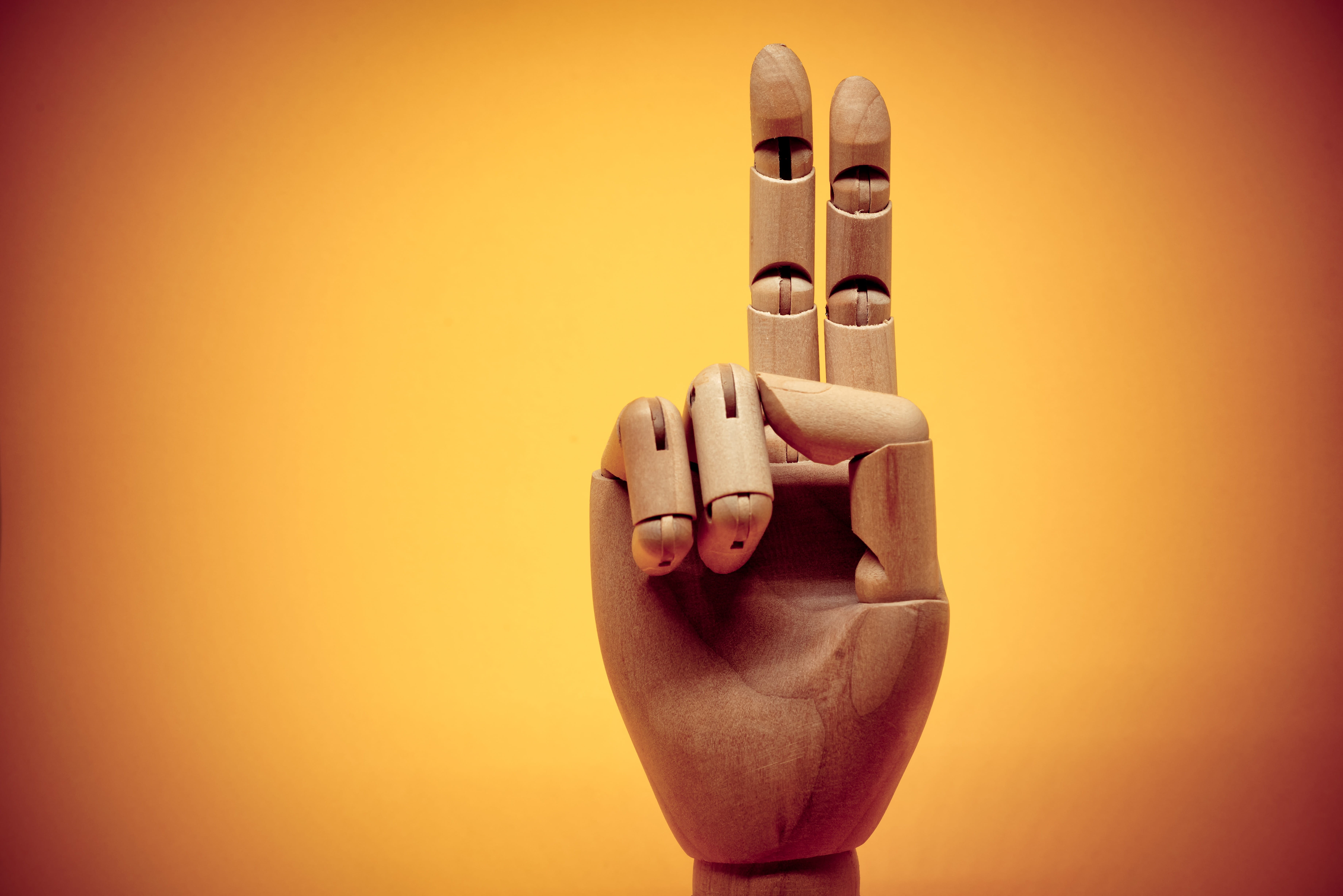 colored background, message, sign, robot, symbol, figurine, yellow, thumb, 5K, detail, studio shot, human representation, art and craft, wood, toy, hand, HD Wallpaper