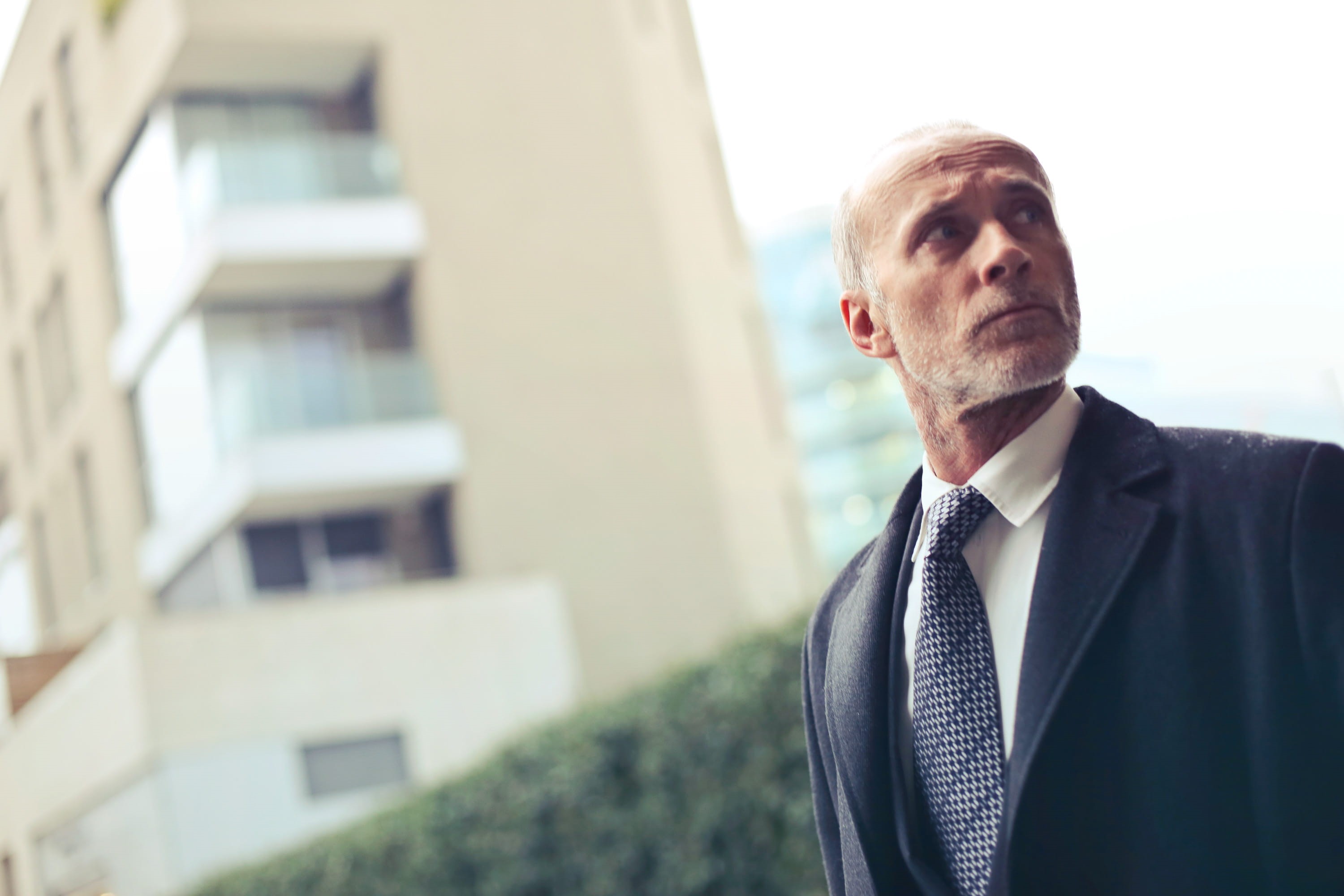 corporate business, person, doubt, coat, mature men, business, man, clothing, city, office building exterior, males, work, looking, one person, tie, job, HD Wallpaper