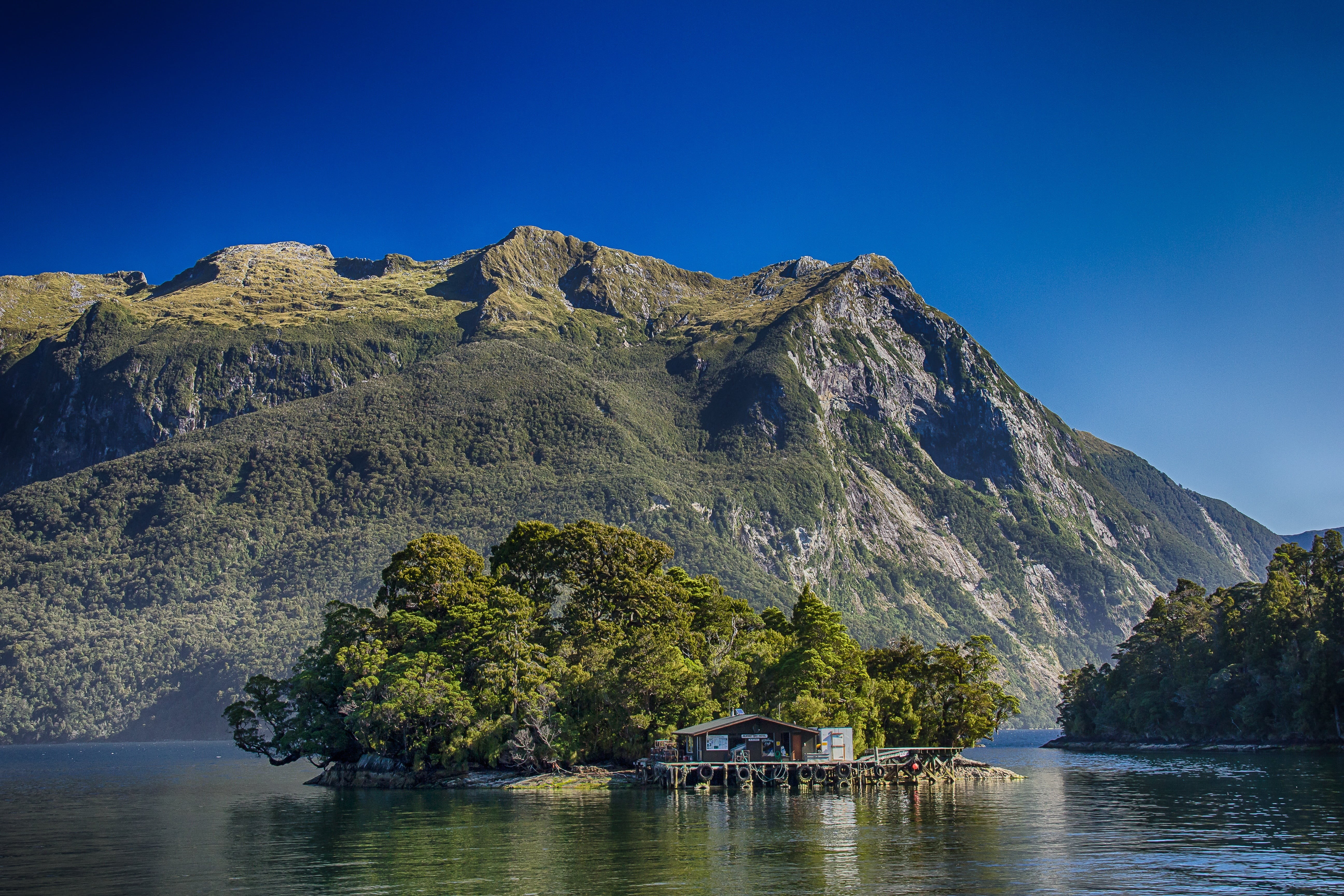 architecture, plant, doubtful sound, rock - object, beauty in nature, land, brown, water, fjord, solid, mountain, nature, sky, body, near, outdoors, hut, HD Wallpaper